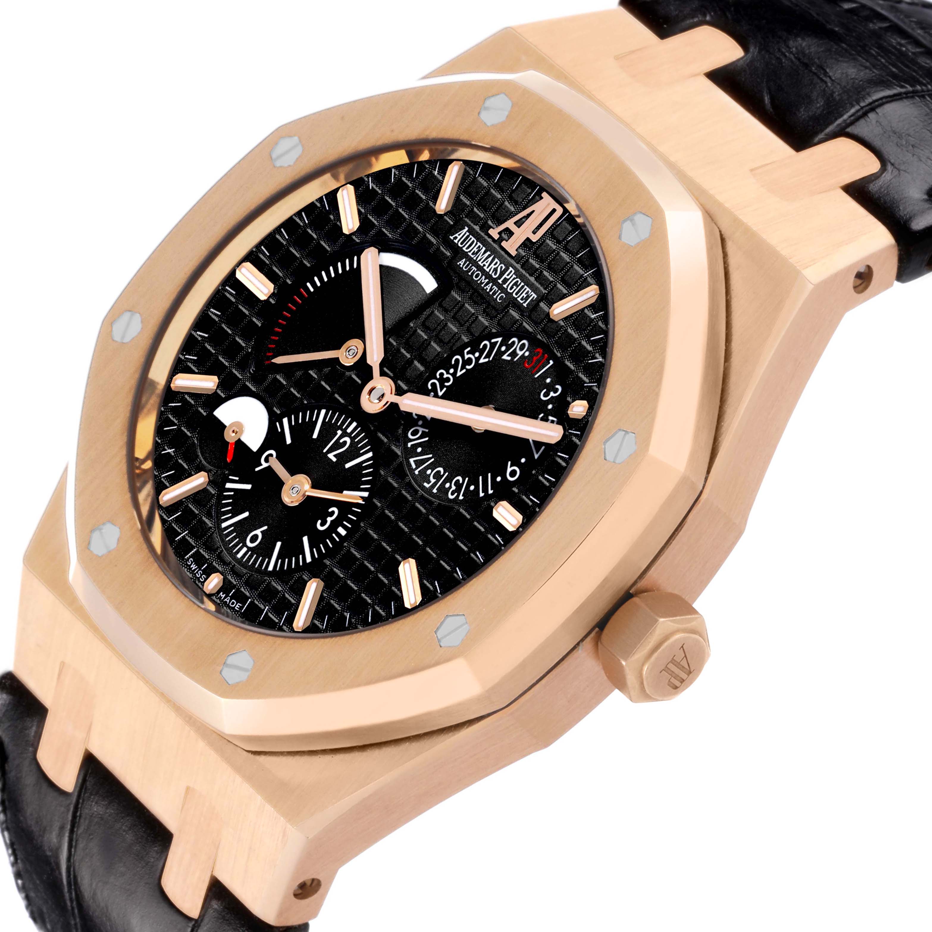 The Audemars Piguet Royal Oak 26120OR.OO.D088CR.01 Men's Rose Gold Black Dial 26120OR.OO.D088CR.01 Men's Rose Gold Black Dial watch is shown from a tilted side angle, highlighting the bezel, face, and leather strap.