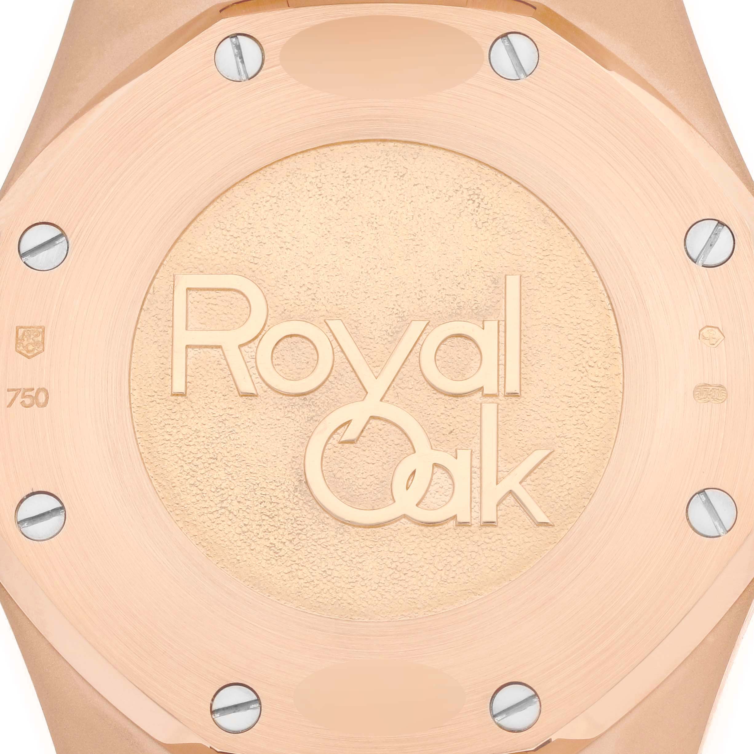 This image shows a close-up of the back case of the Royal Oak watch by Audemars Piguet, highlighting the "Royal Oak" engraving.