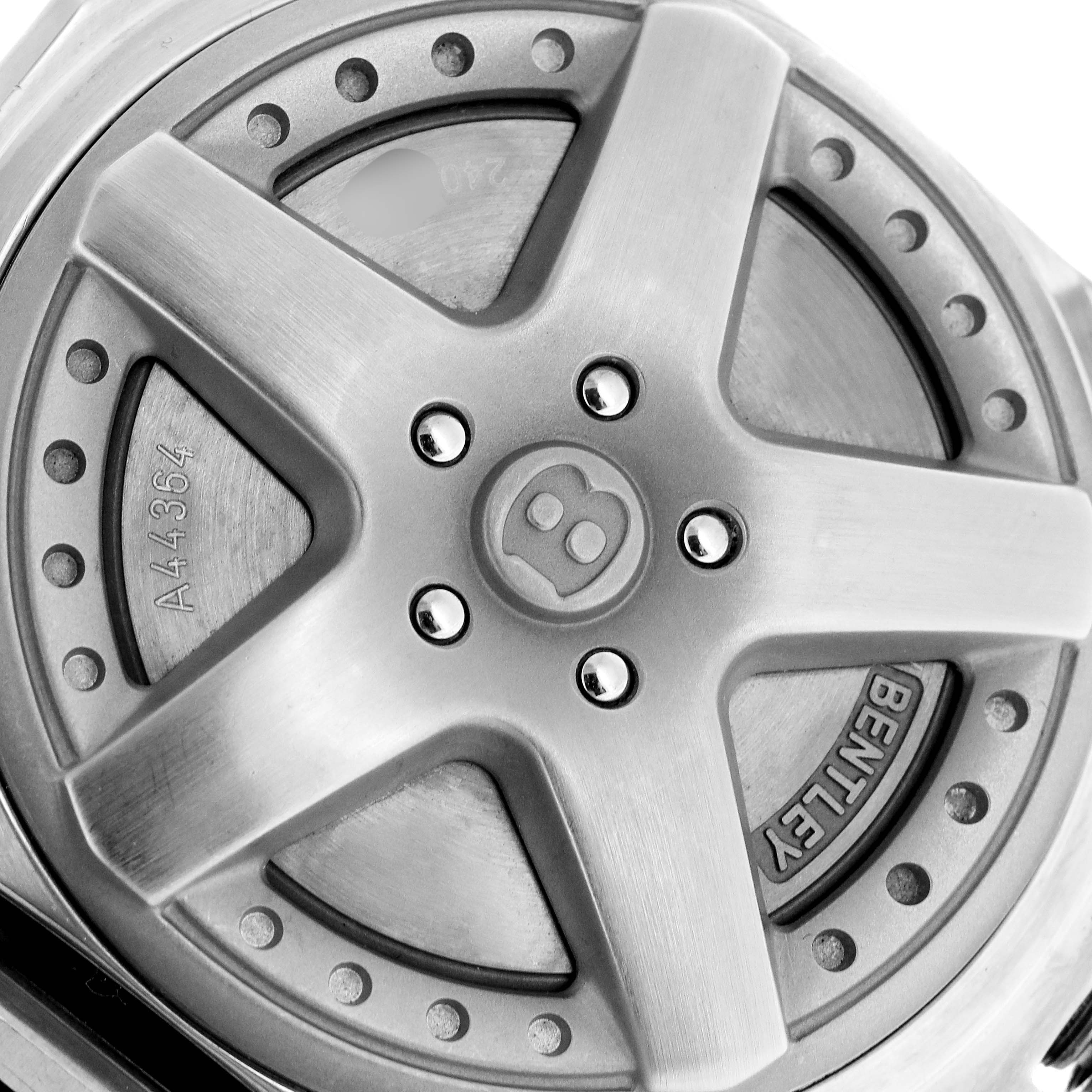 This image shows a close-up of the Bentley model watch caseback by Breitling, highlighting the Bentley emblem and serial number.