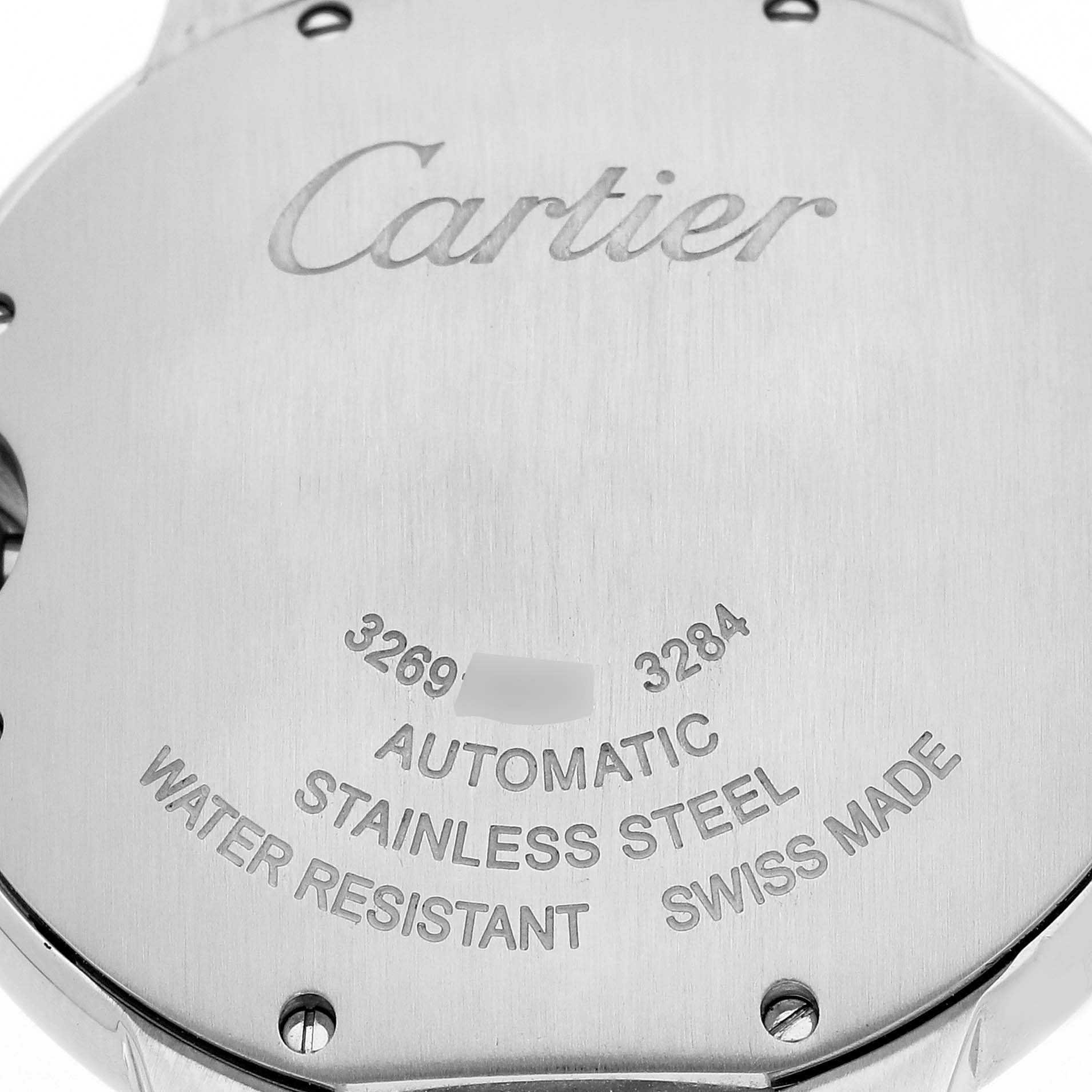 The image shows the back of a Cartier Ballon Bleu W6920033 Women's Steel and Gold (two tone) Mother of Pearl Dial W6920033 Women's Steel and Gold (two tone) Mother of Pearl Dial watch, highlighting its stainless steel construction and inscriptions.