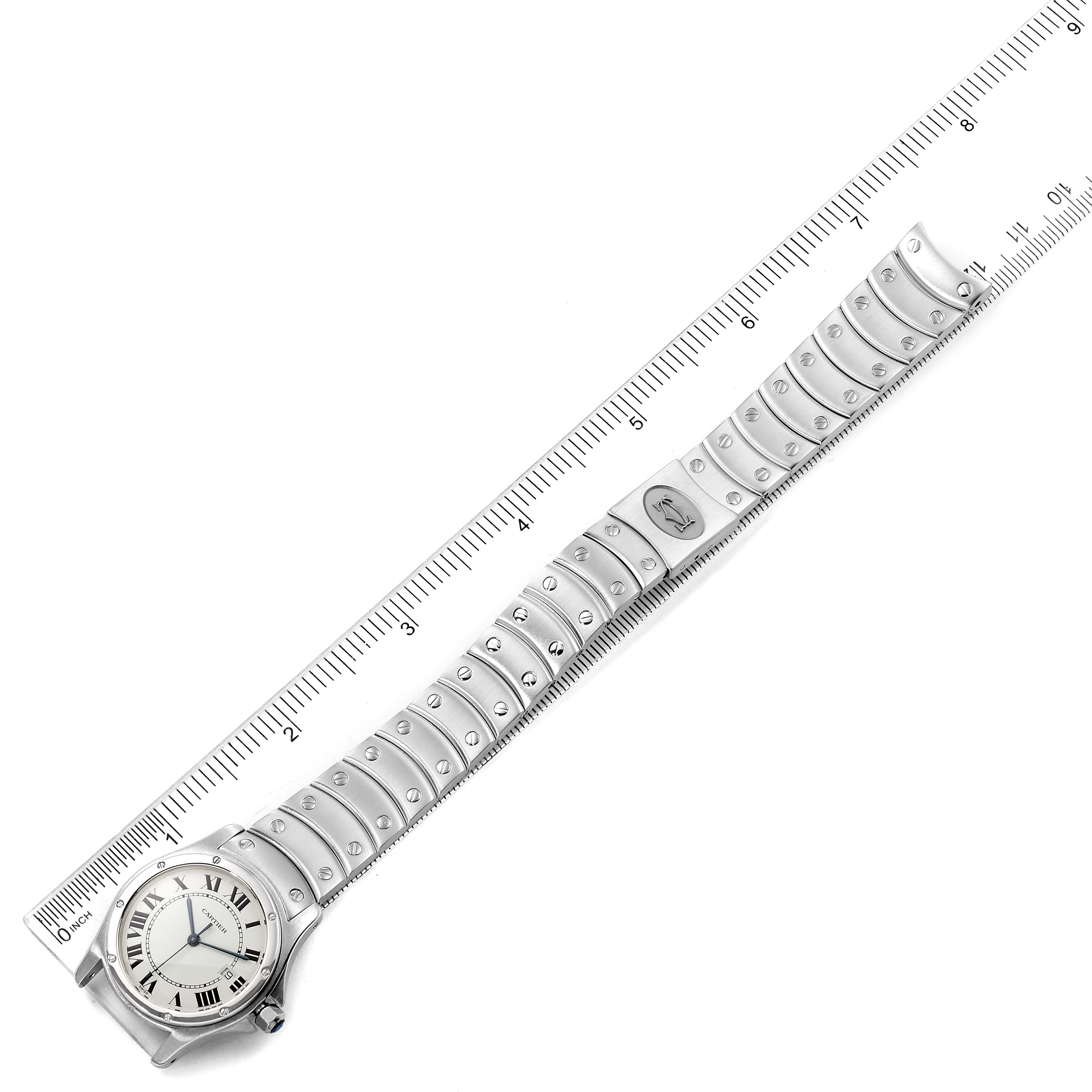 The image shows the Cartier Santos 1561 Men
s Stainless Steel White Dial 1561 Men
s Stainless Steel White Dial model watch laid flat with a focus on its entire bracelet and face, aligned with a ruler.