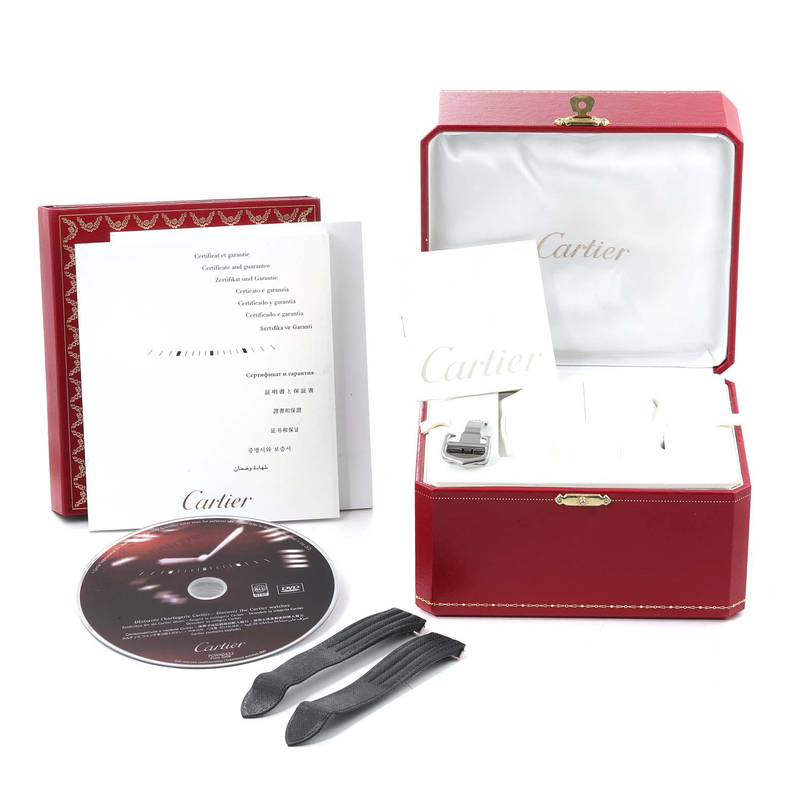 This image shows the accessories of a Cartier Roadster W62025V3 Men
s Stainless Steel Silver Dial W62025V3 Men
s Stainless Steel Silver Dial watch, including the box, manuals, CD, and additional straps.