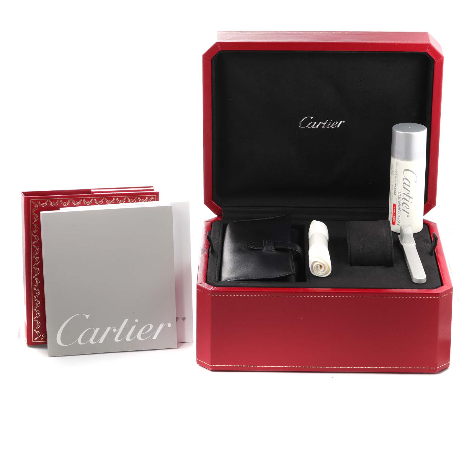 The image shows accessories for the Cartier Roadster W62002V3 Men
s Stainless Steel Black Dial W62002V3 Men
s Stainless Steel Black Dial watch, including a red box, a cleaning kit, and manuals.