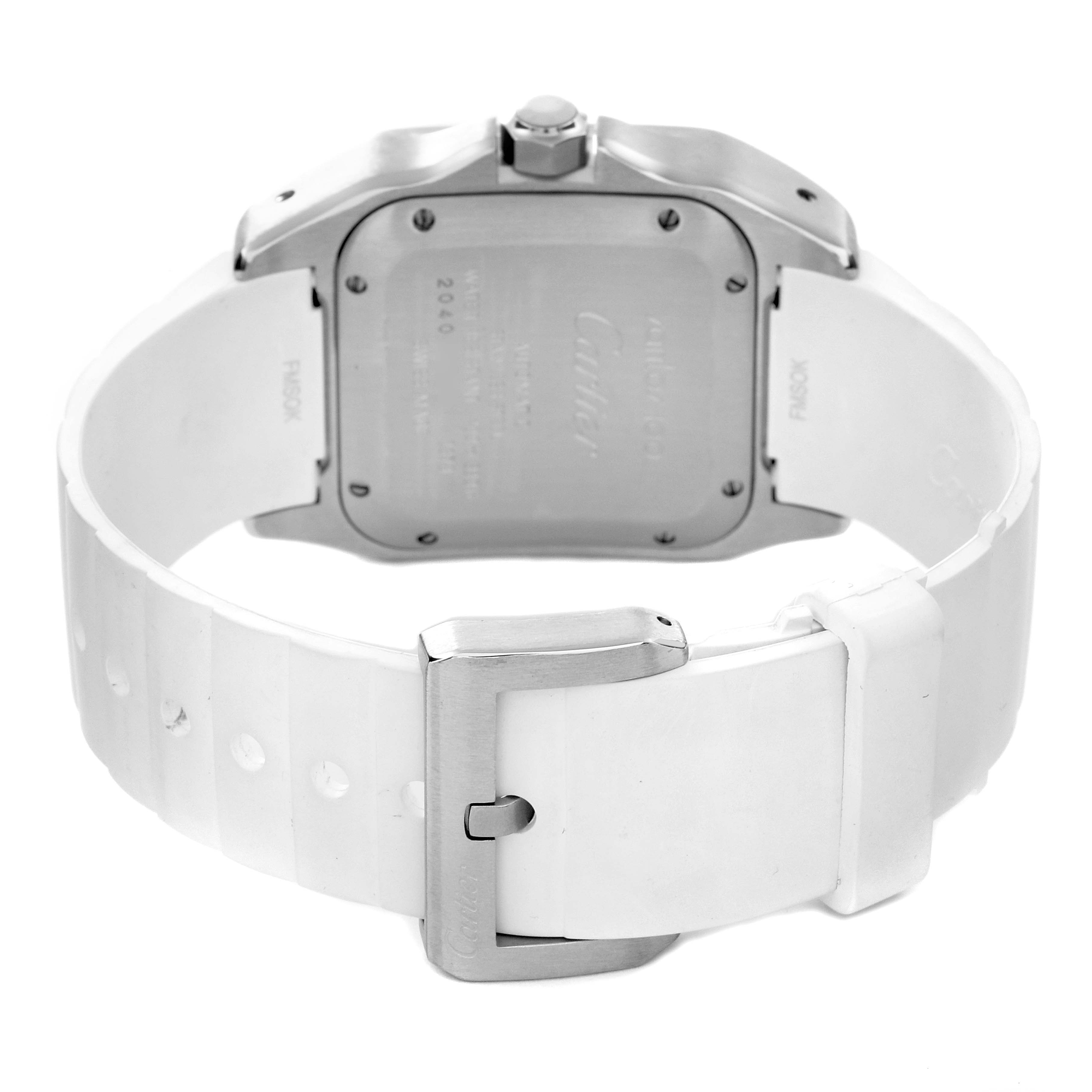 The image shows the back of a Santos model Cartier watch with a white strap and metal buckle.