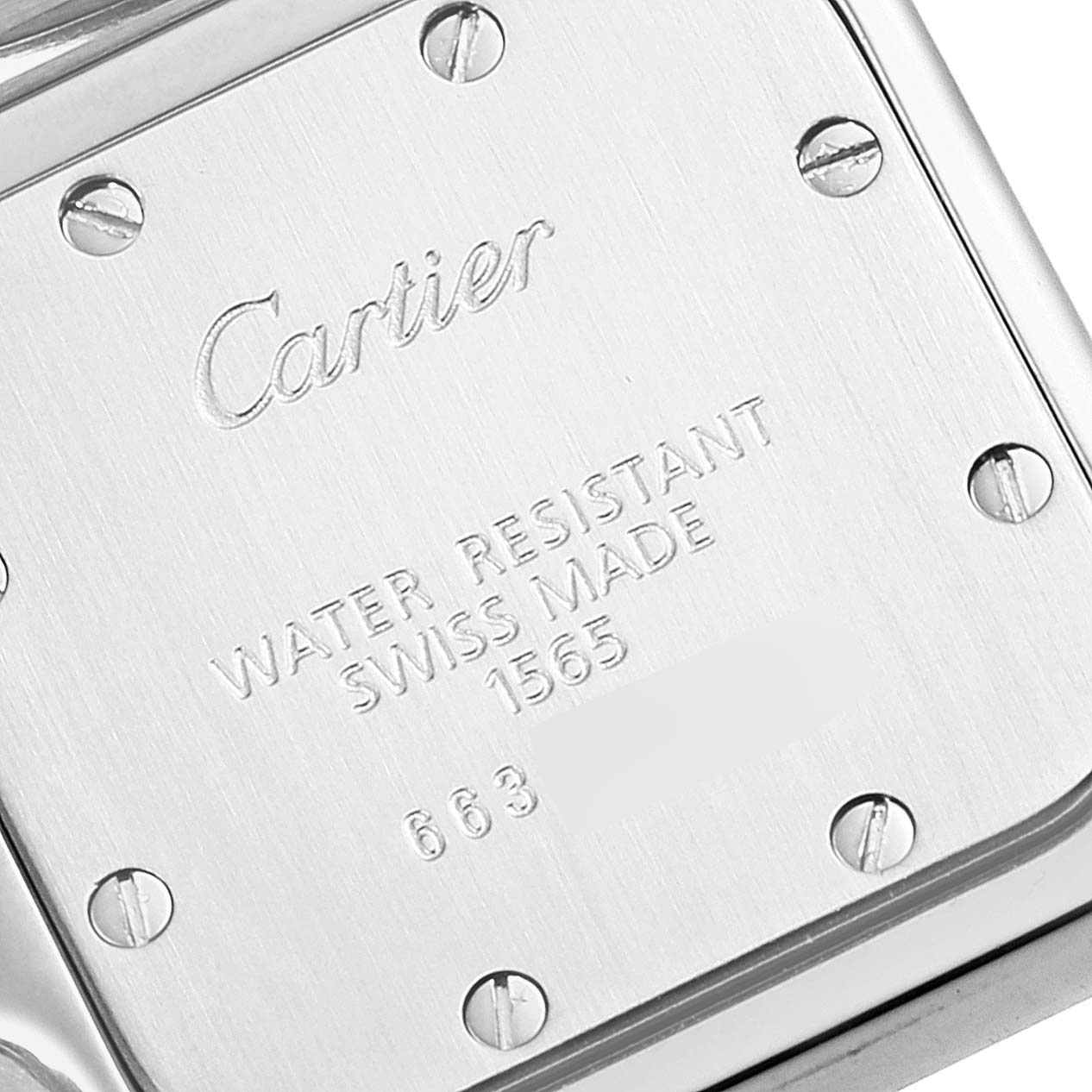 This image shows a close-up of the case back of a Cartier Santos W20056D6 Women's Stainless Steel Silver Dial W20056D6 Women's Stainless Steel Silver Dial watch, displaying brand engraving and screw details.