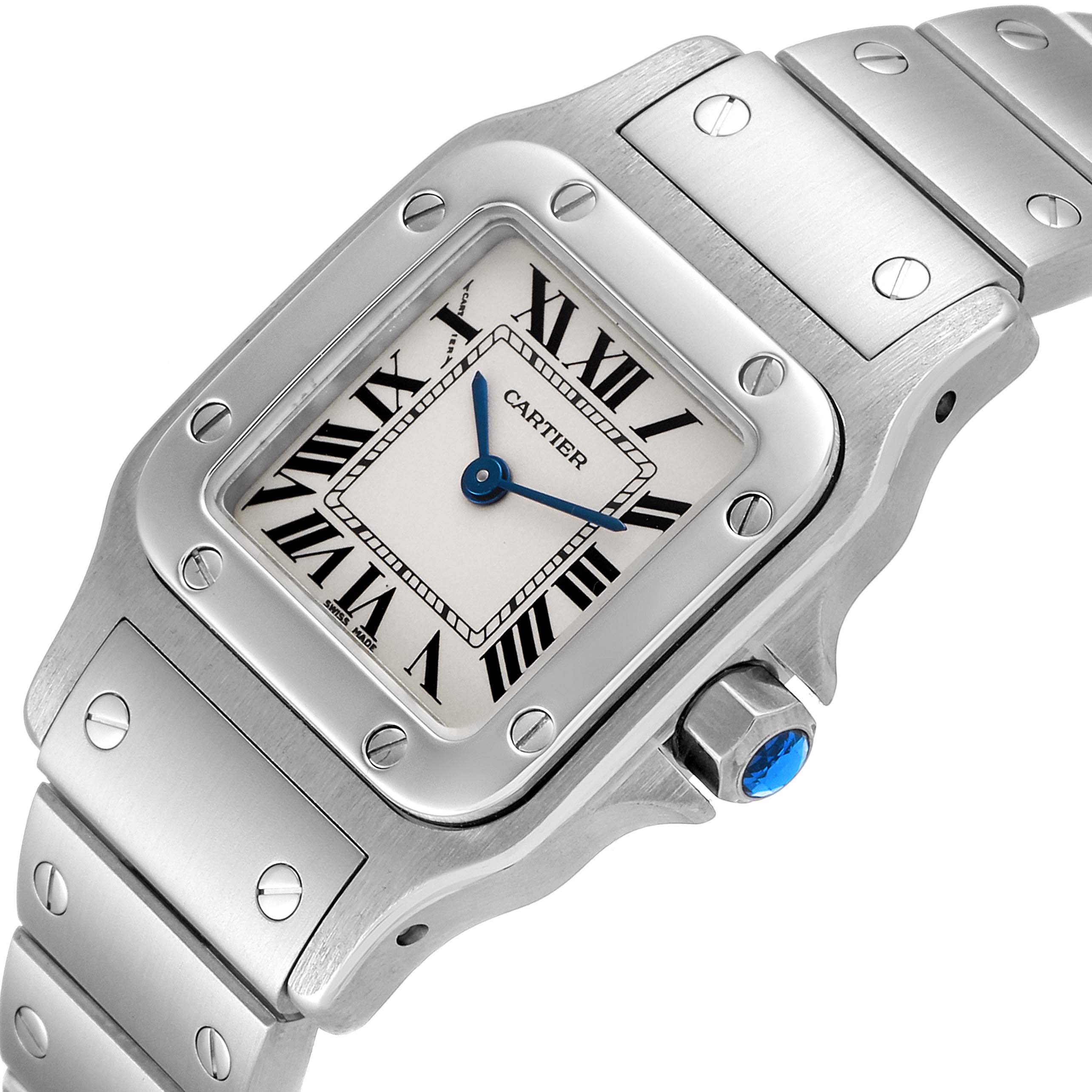 This image shows a close-up of the Cartier Santos W20056D6 Women's Stainless Steel Silver Dial W20056D6 Women's Stainless Steel Silver Dial watch's face, crown, and part of its metal strap.