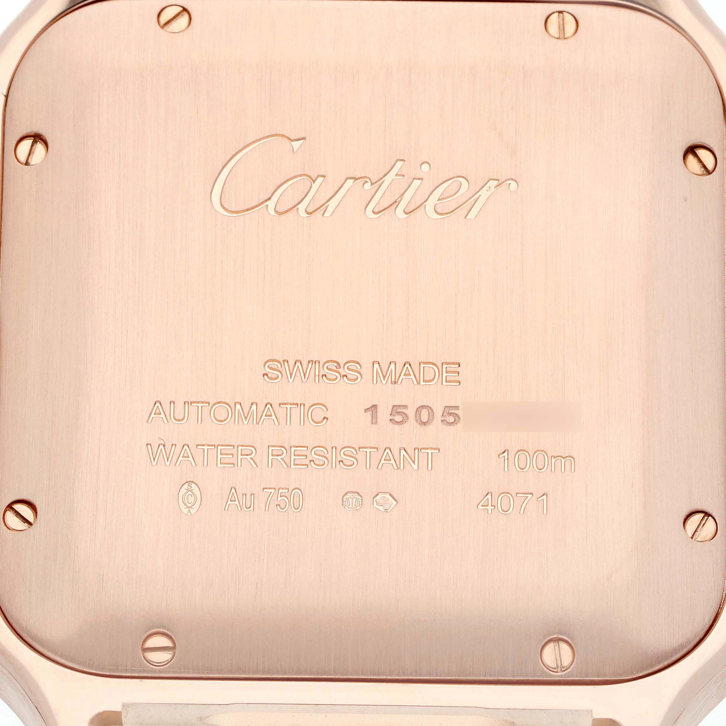 This image shows the case back of a Cartier Santos WGSA0019 Men's Rose Gold Silver Dial WGSA0019 Men's Rose Gold Silver Dial watch, featuring engravings with information about the model.