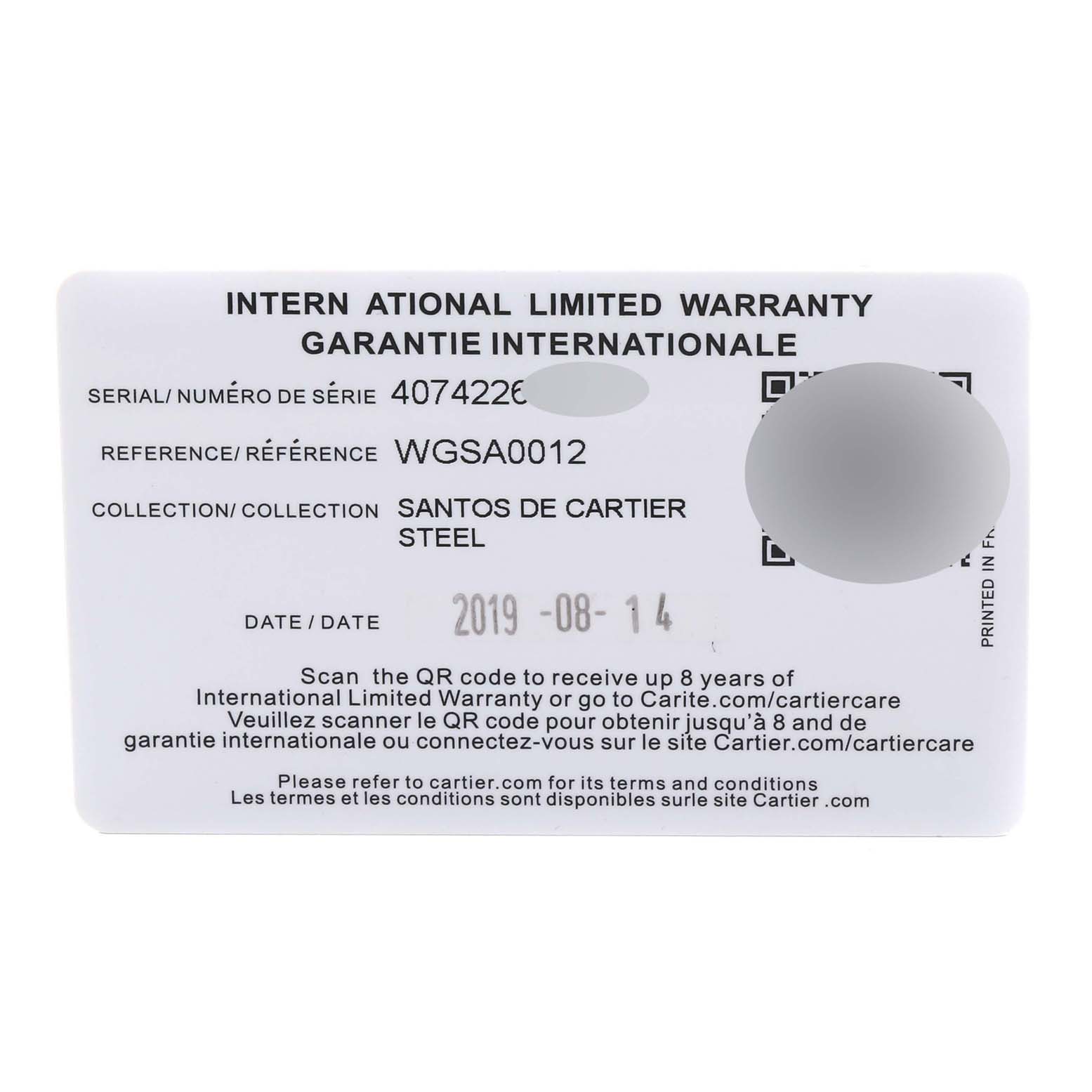 The image shows an International Limited Warranty card for the Santos de Cartier steel model with serial and reference numbers.