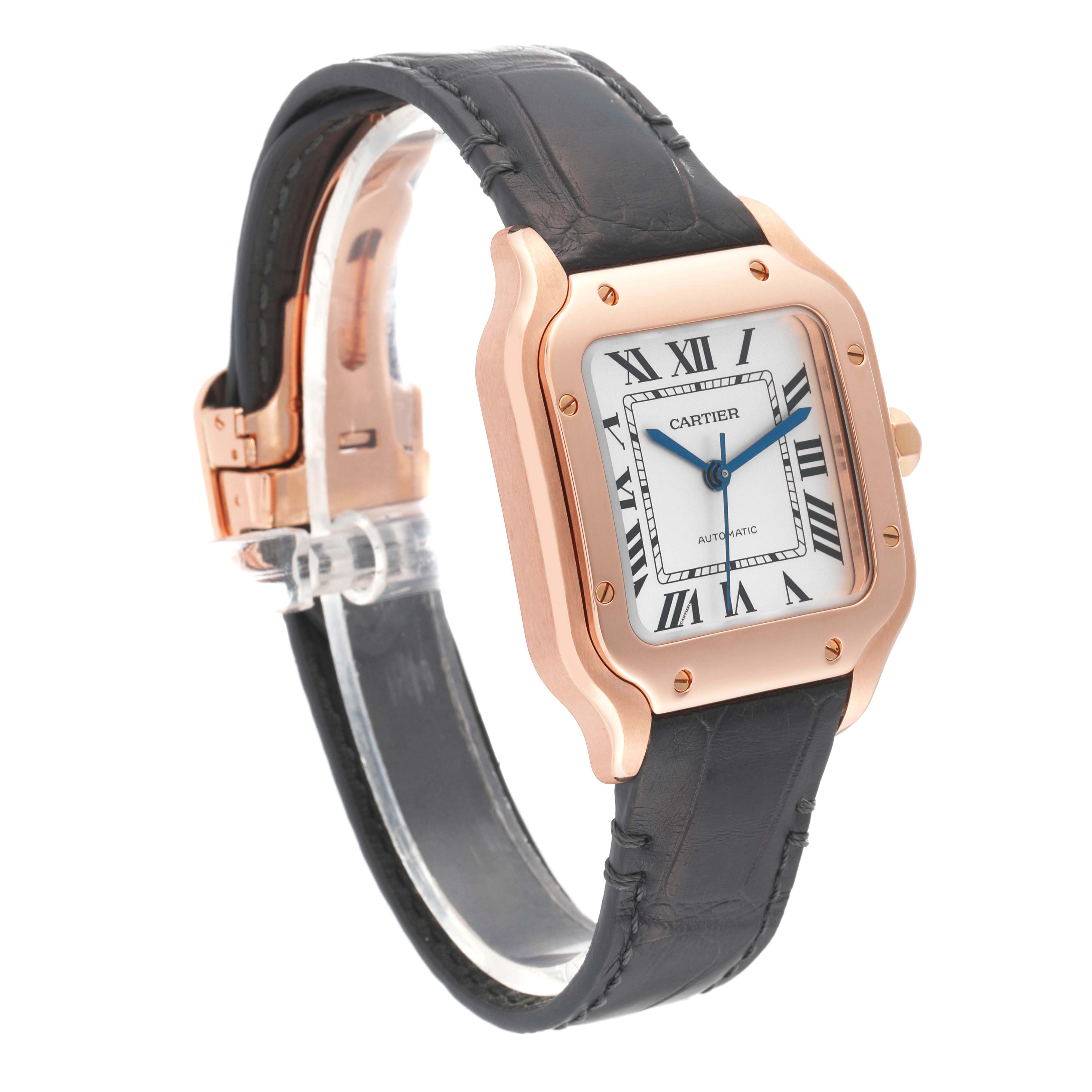 This image shows a Cartier Santos WGSA0012 Men's Rose Gold Silver Dial WGSA0012 Men's Rose Gold Silver Dial watch at a three-quarter angle, highlighting its dial, bezel, and black leather strap.