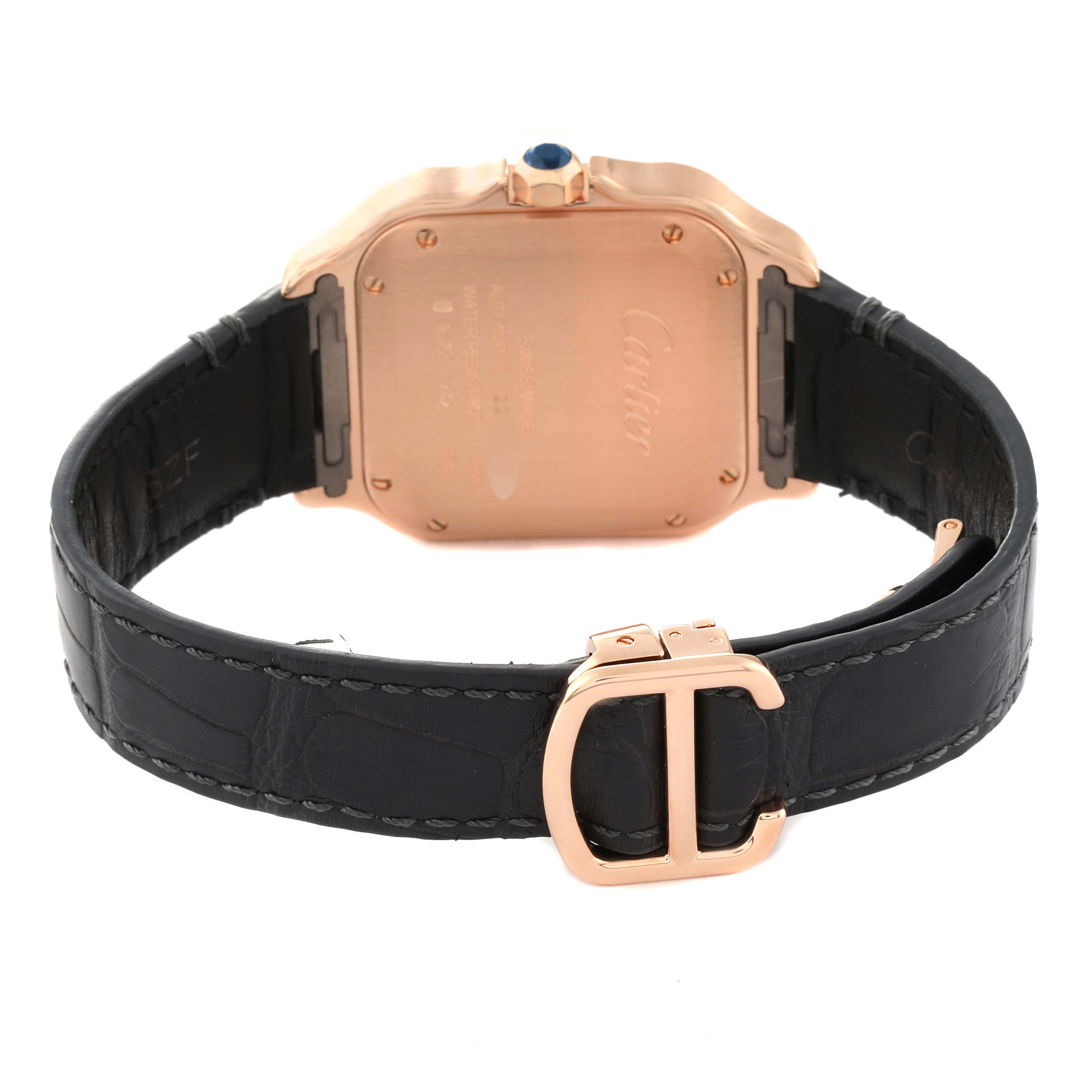 This image shows the back of a Cartier Santos WGSA0012 Men's Rose Gold Silver Dial WGSA0012 Men's Rose Gold Silver Dial watch, including its case back, leather strap, and buckle.