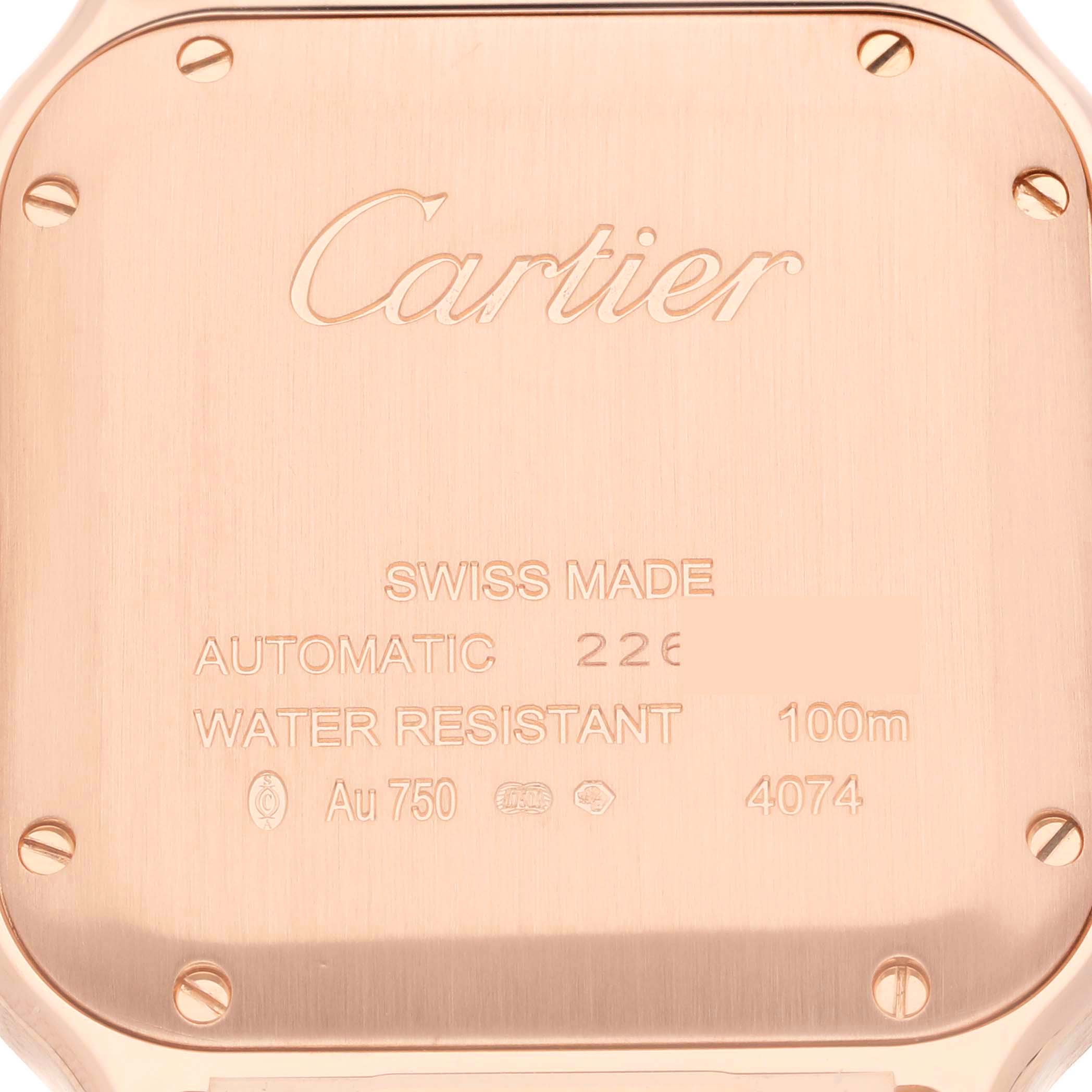 The image shows the back casing of a Cartier Santos WGSA0012 Men's Rose Gold Silver Dial WGSA0012 Men's Rose Gold Silver Dial watch, highlighting its specifications and brand engravings.