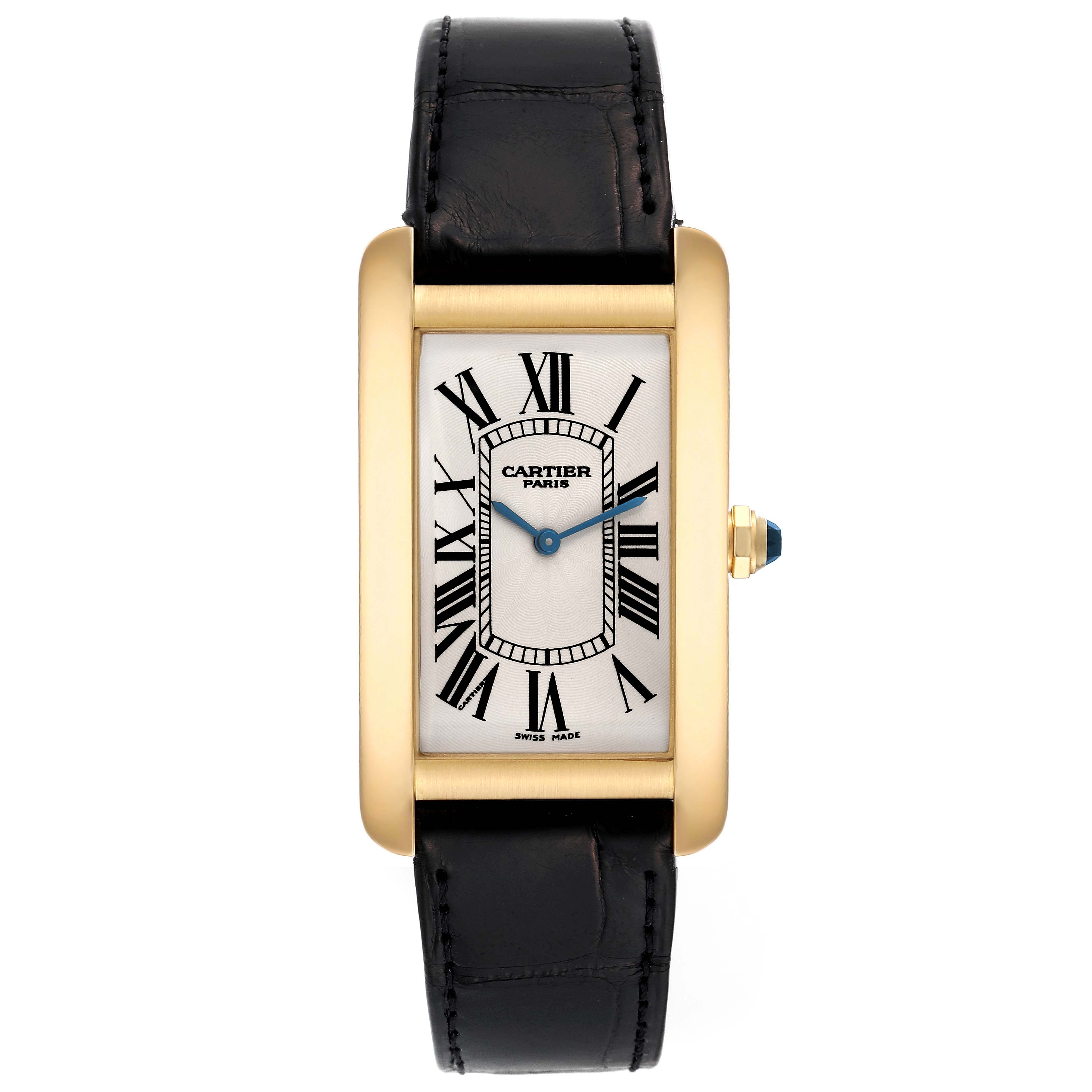 This image shows a frontal view of a Cartier Tank Americaine 1735 Men's Yellow Gold Silver Dial 1735 Men's Yellow Gold Silver Dial watch, highlighting its face, strap, and crown.