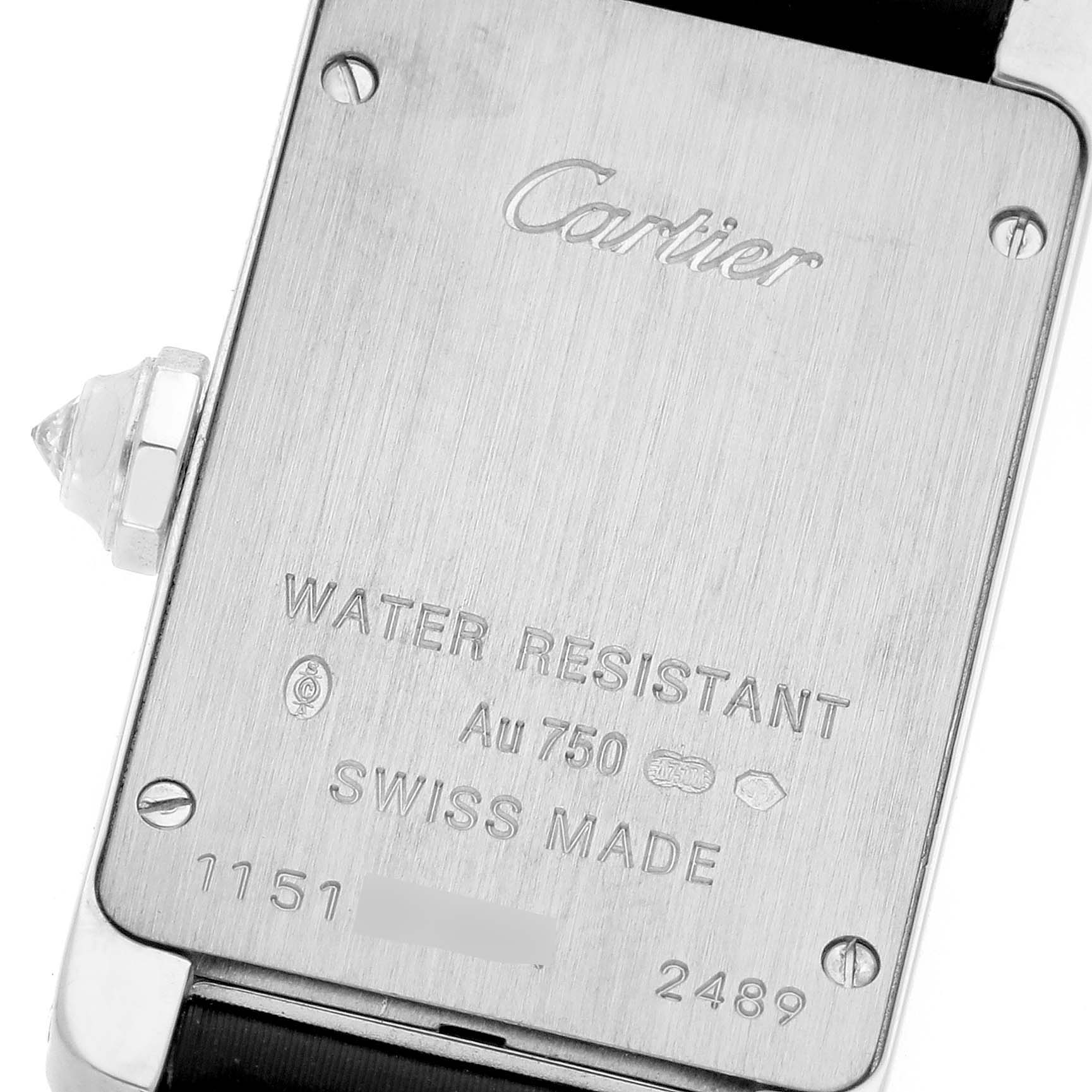 The image shows the back case of a Cartier Tank Americaine WB707331 Women's White Gold Silver Dial WB707331 Women's White Gold Silver Dial watch, highlighting engravings and screws.