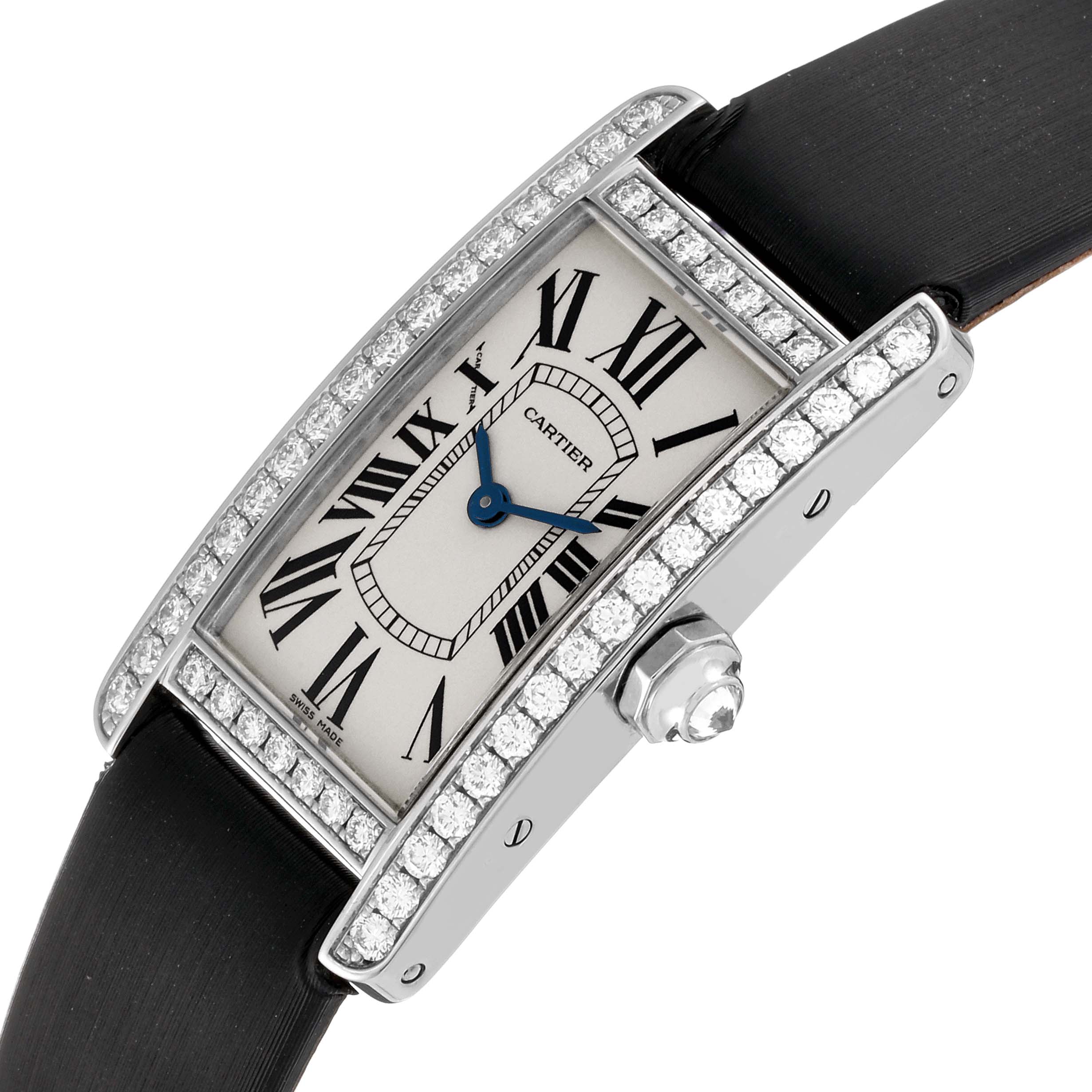 The Cartier Tank Americaine WB707331 Women's White Gold Silver Dial WB707331 Women's White Gold Silver Dial watch is shown at a tilted angle, highlighting its rectangular face, diamond bezel, and black strap.