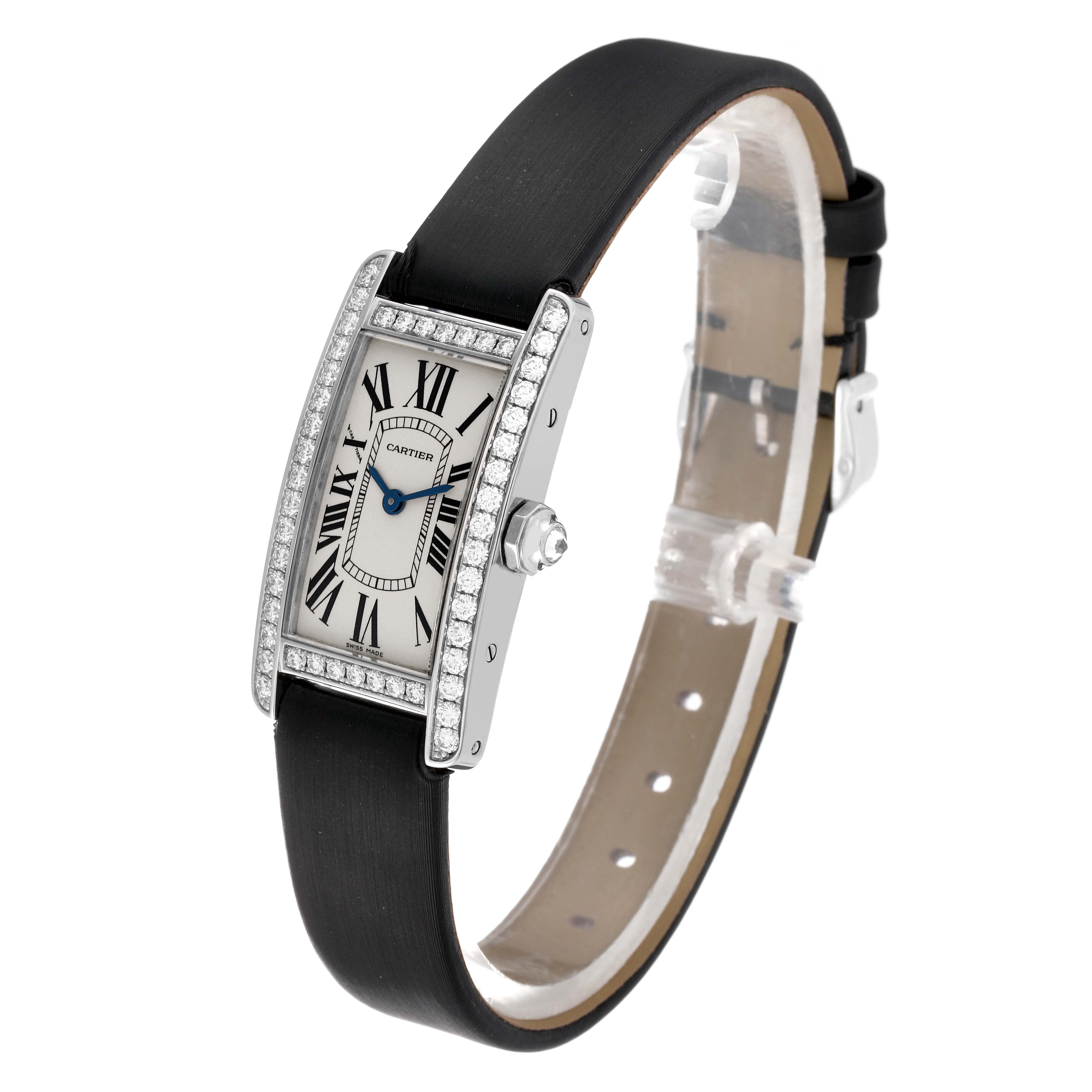 The image shows a side view of the Tank Americaine model by Cartier, featuring a black strap and diamond-encrusted rectangular case.