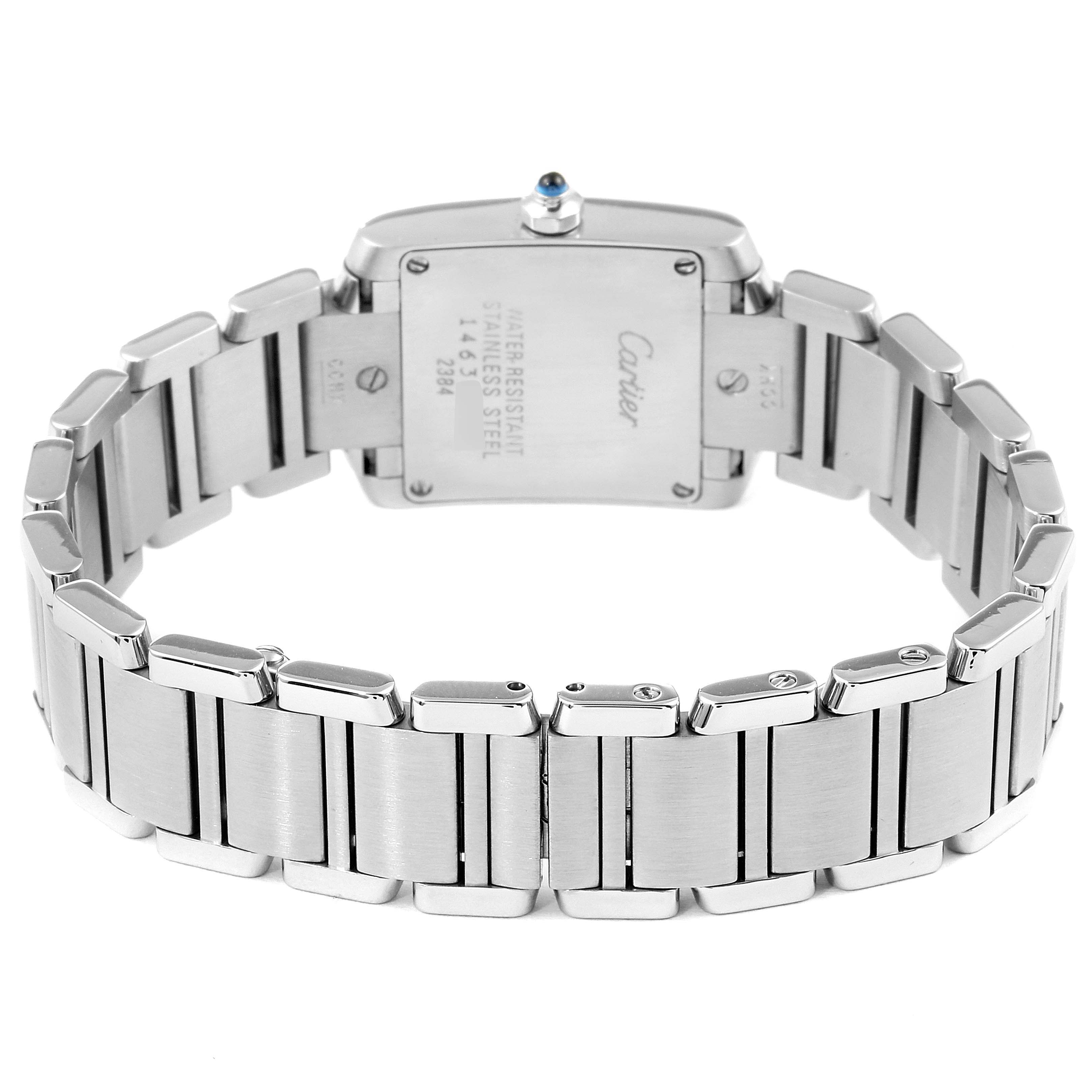 The image shows the back casing and bracelet of a Tank Francaise model by Cartier, highlighting the stainless steel links.