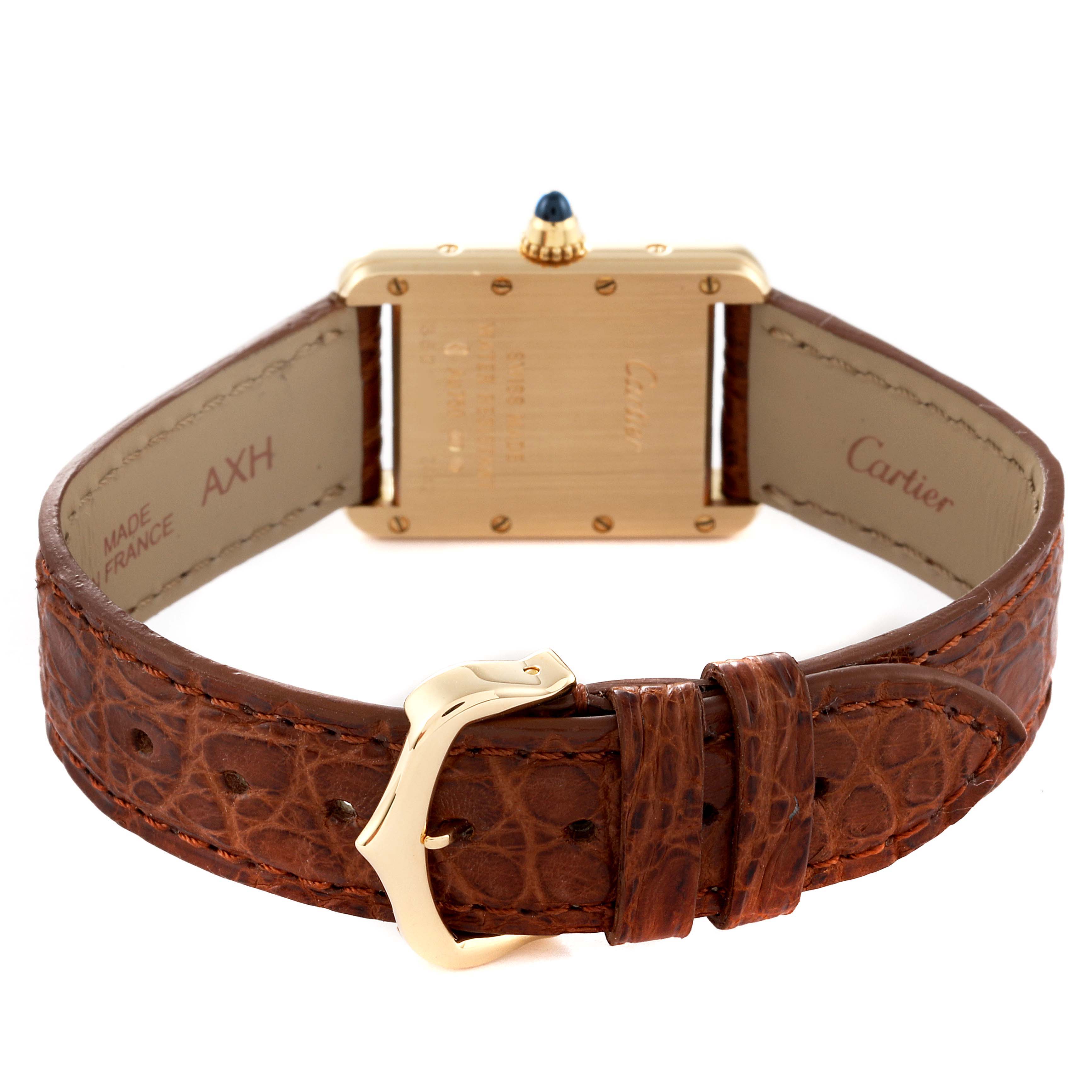 The image shows the back view of the Tank Louis model by Cartier, highlighting its leather strap and buckle.