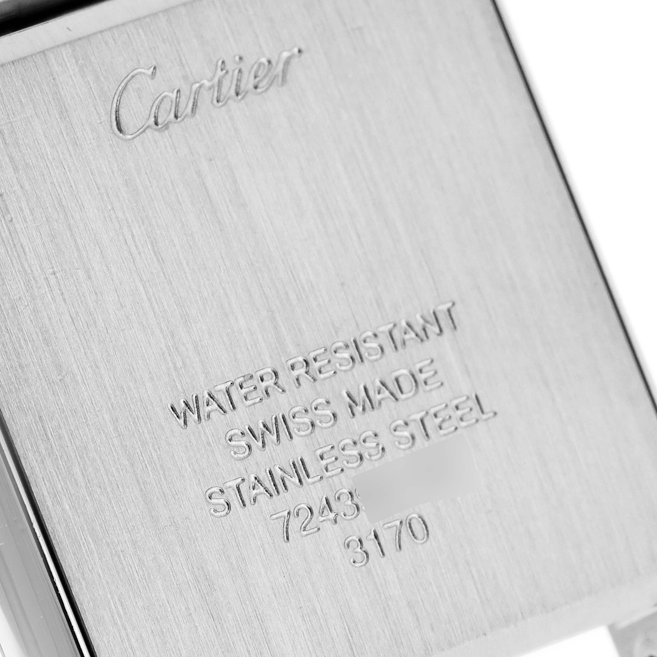 The image shows the engraved back case of a Cartier Tank Solo W5200013 Women
s Stainless Steel Silver Dial W5200013 Women
s Stainless Steel Silver Dial watch in stainless steel.
