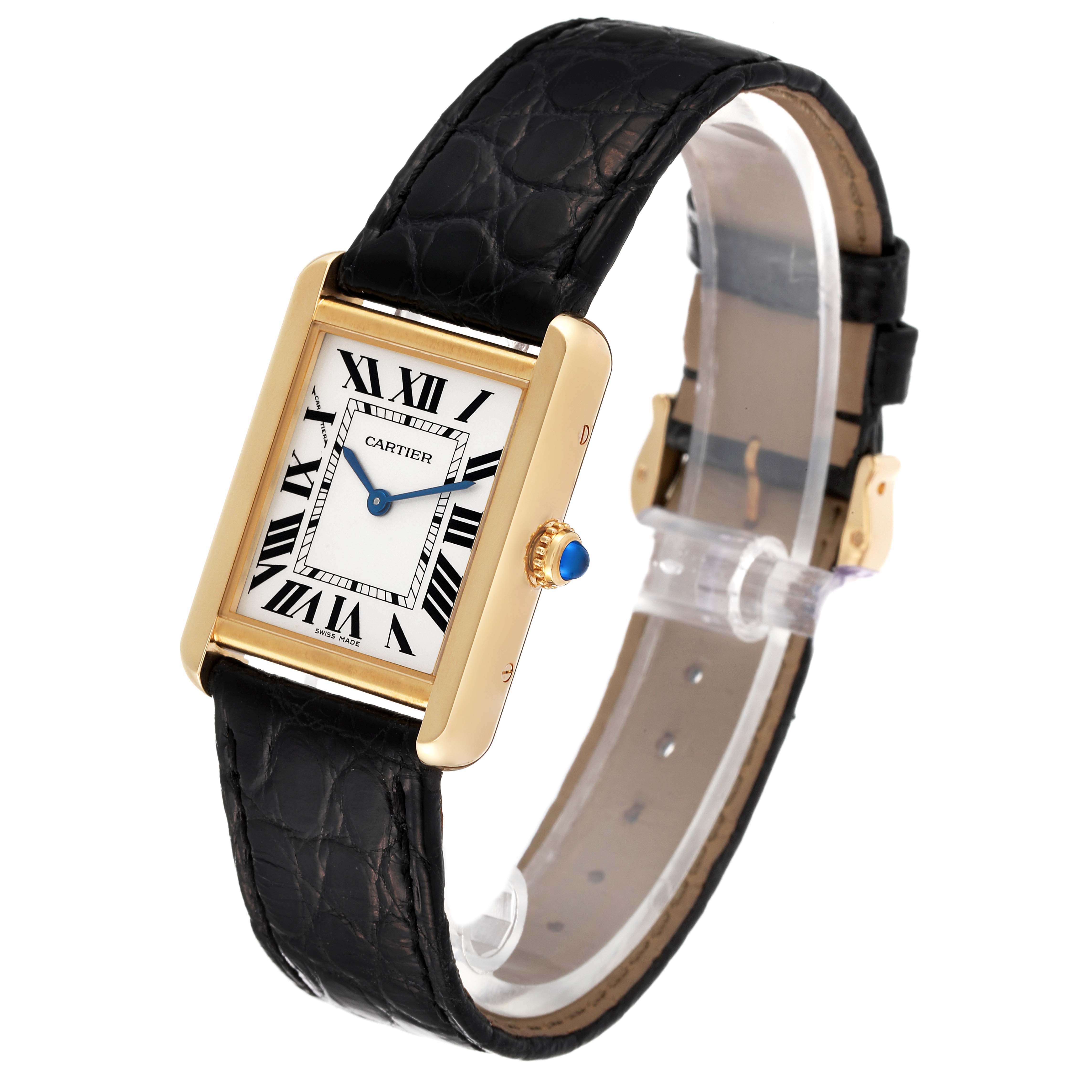 This image showcases a Cartier Tank Solo W1018755 Women's Yellow Gold Silver Dial W1018755 Women's Yellow Gold Silver Dial watch, displaying its rectangular dial, Roman numerals, black strap, and gold casing from an angled view.