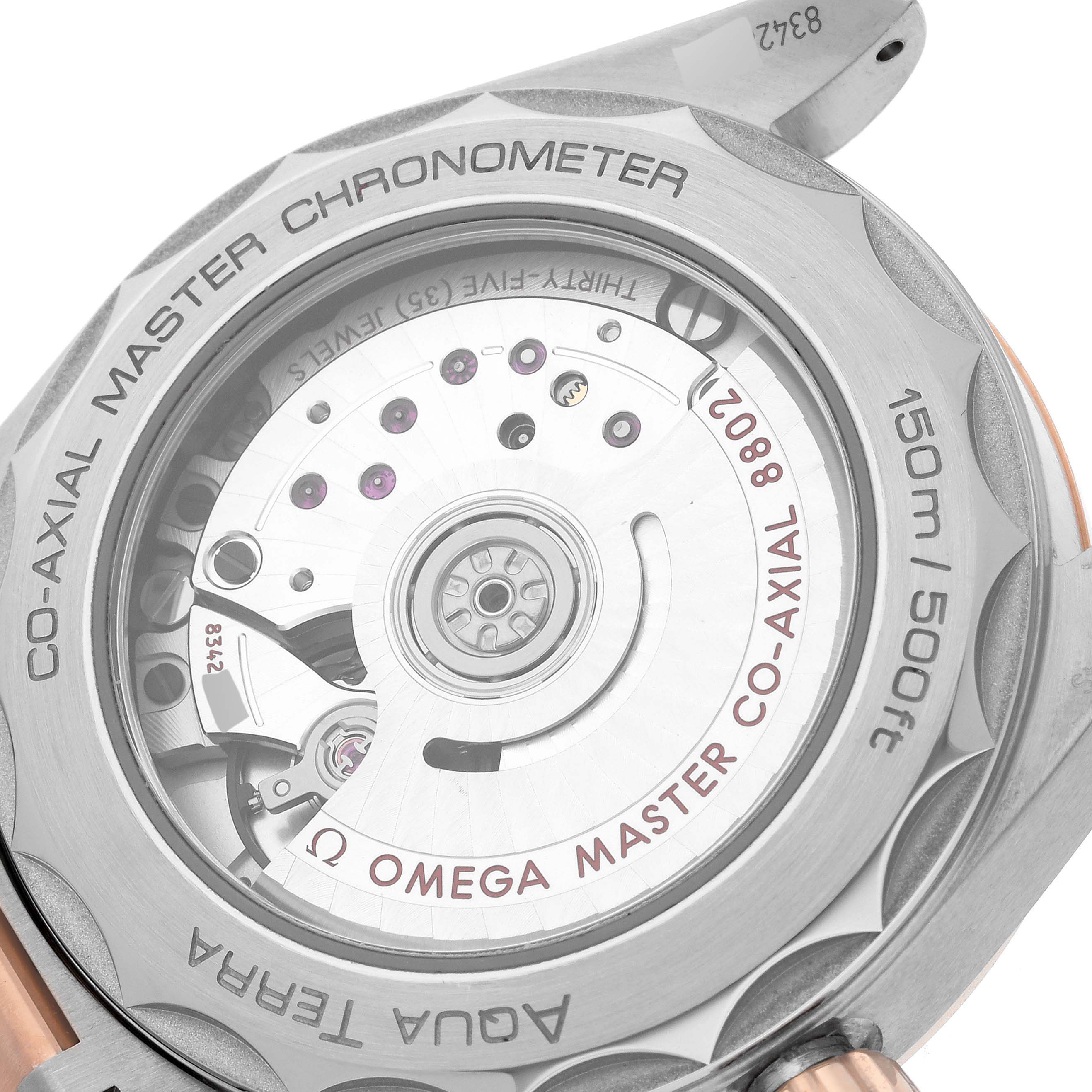 The image shows the back view of the Omega 220.20.38.20.55.002 Women's Steel and Gold (two tone) Mother of Pearl Dial 220.20.38.20.55.002 Women's Steel and Gold (two tone) Mother of Pearl Dial Aqua Terra model 220.20.38.20.55.002, focusing on its movement and engravings.