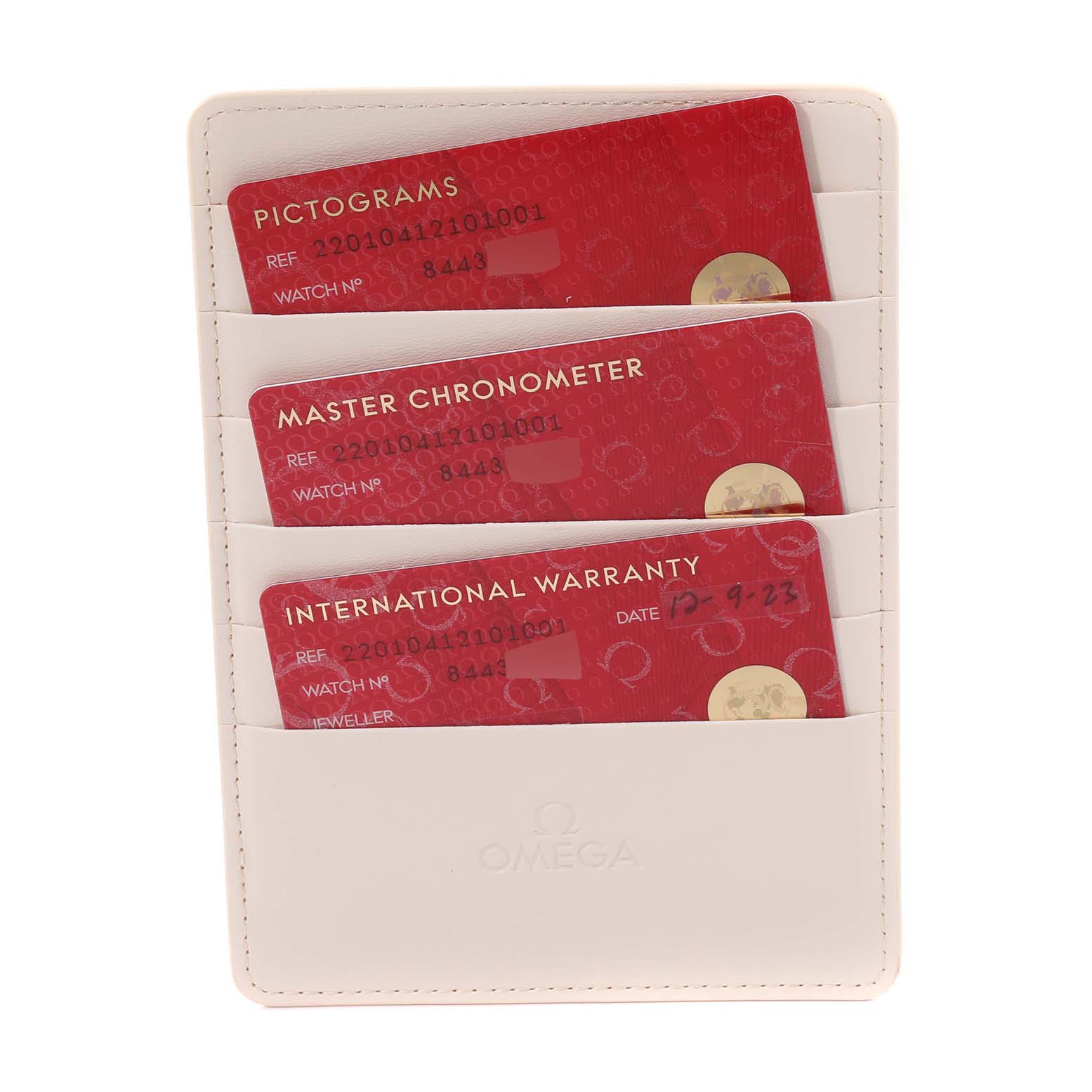 The image shows the Omega Aqua Terra 220.10.41.21.01.001 Men's Stainless Steel Black Dial 220.10.41.21.01.001 Men's Stainless Steel Black Dial model cards for Pictograms, Master Chronometer, and International Warranty in a holder.