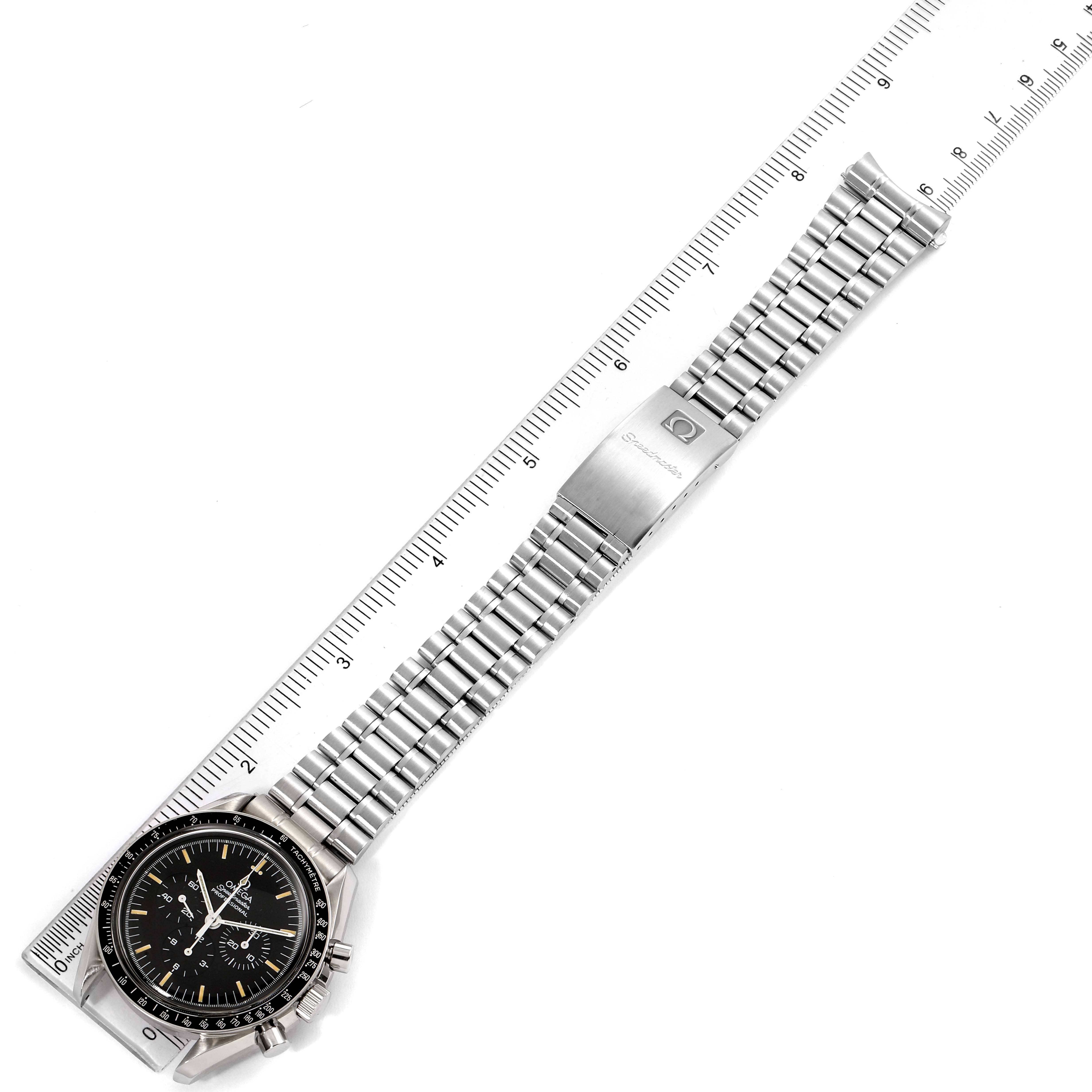 The image shows an Omega Speedmaster 3590.50.00 Men's Stainless Steel Black Dial 3590.50.00 Men's Stainless Steel Black Dial watch flat with the dial and metal bracelet visible, aligned next to a ruler.