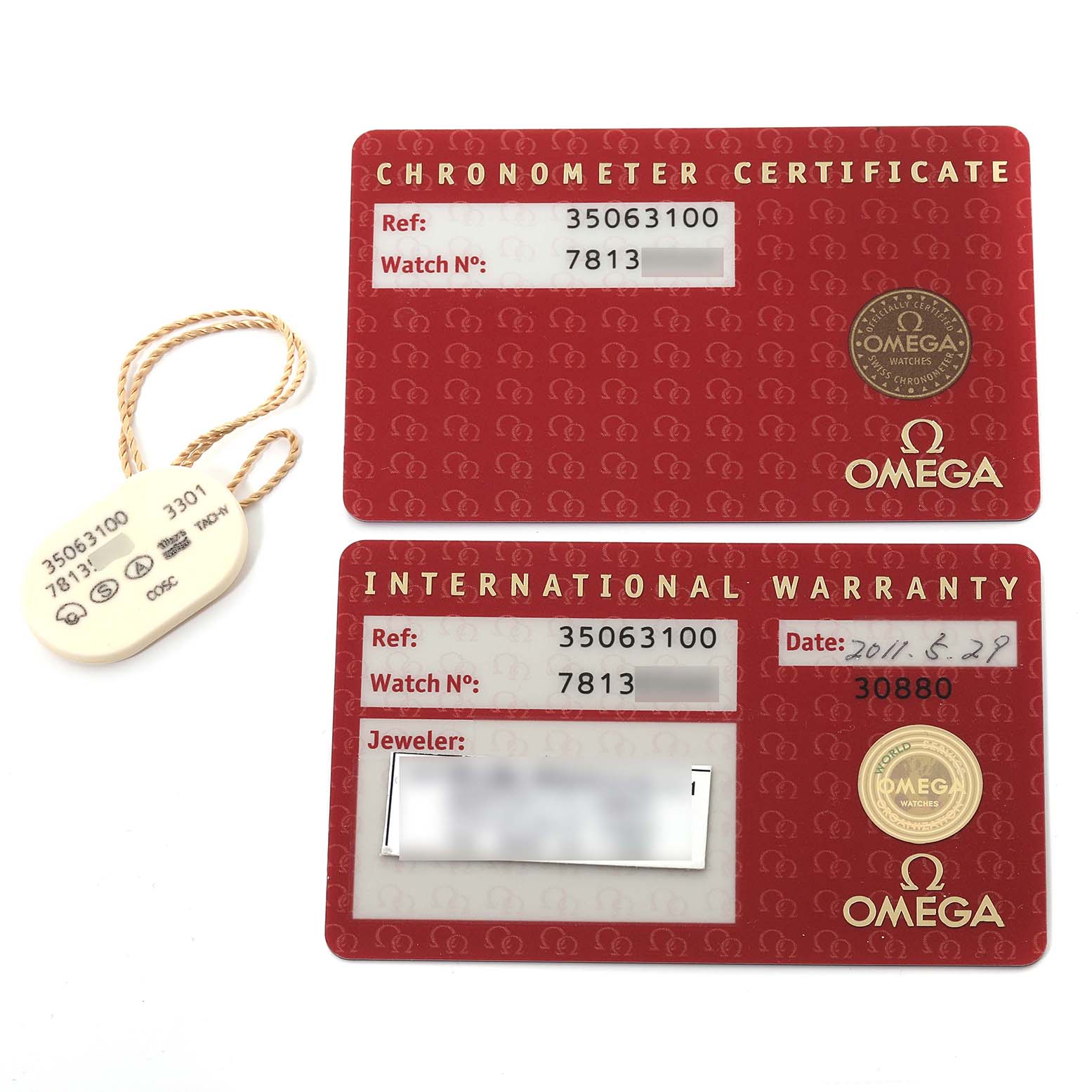 The image shows a Chronometer Certificate, an International Warranty card, and a tag for the Omega Speedmaster 3506.31.00 Men
s Stainless Steel Silver Dial 3506.31.00 Men
s Stainless Steel Silver Dial.