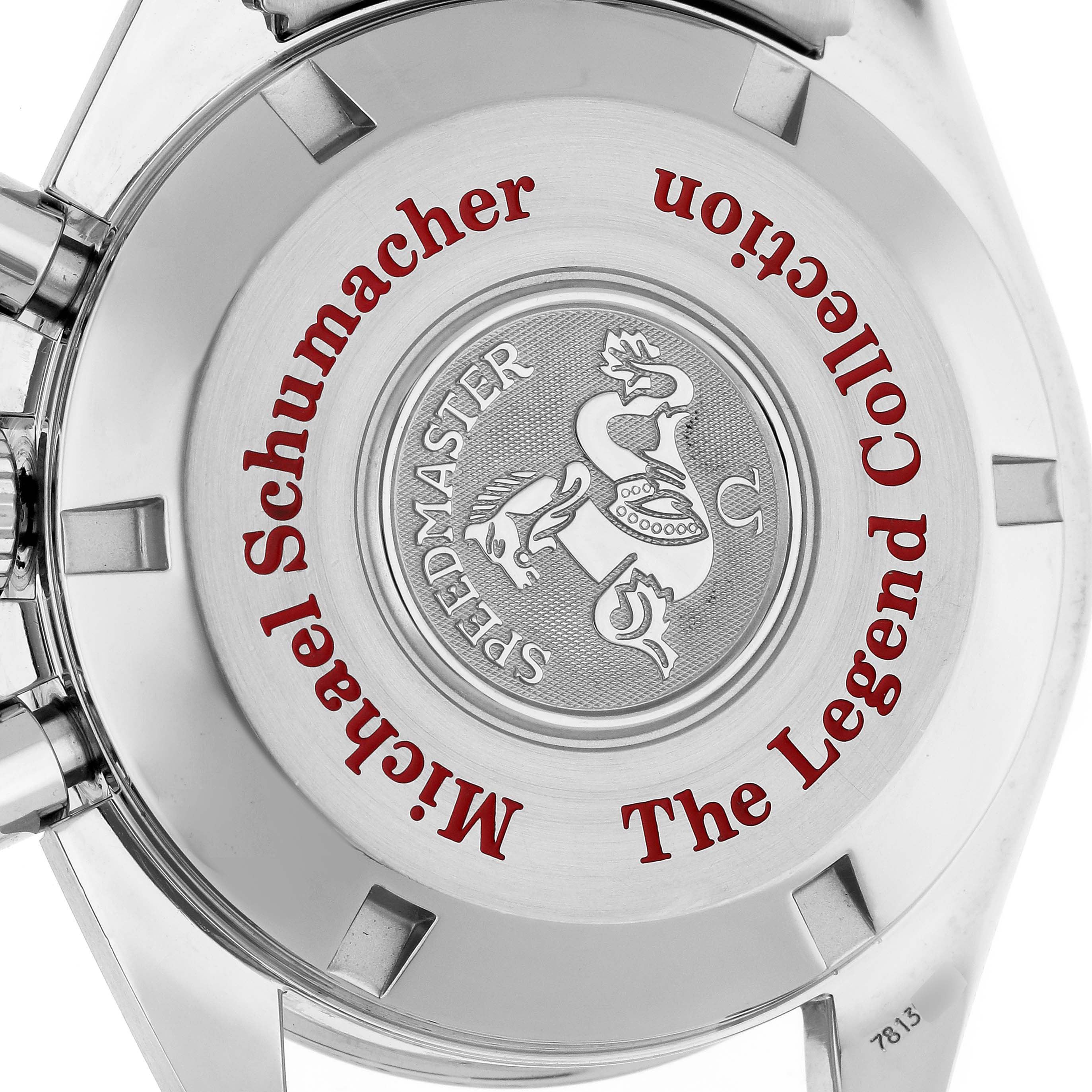 The image shows the case back of an Omega Speedmaster 3506.31.00 Men
s Stainless Steel Silver Dial 3506.31.00 Men
s Stainless Steel Silver Dial watch, featuring "Michael Schumacher The Legend Collection" text.