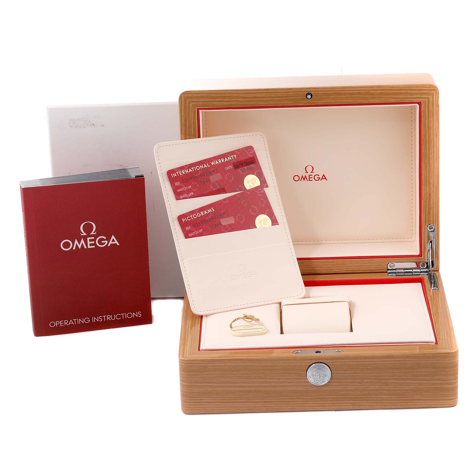 This image shows the packaging, warranty cards, operating instructions, and box of the Omega Speedmaster 321.90.42.50.13.001 Men's Steel and Gold (two tone) Brown Dial 321.90.42.50.13.001 Men's Steel and Gold (two tone) Brown Dial watch, all viewed from an angled top perspective.