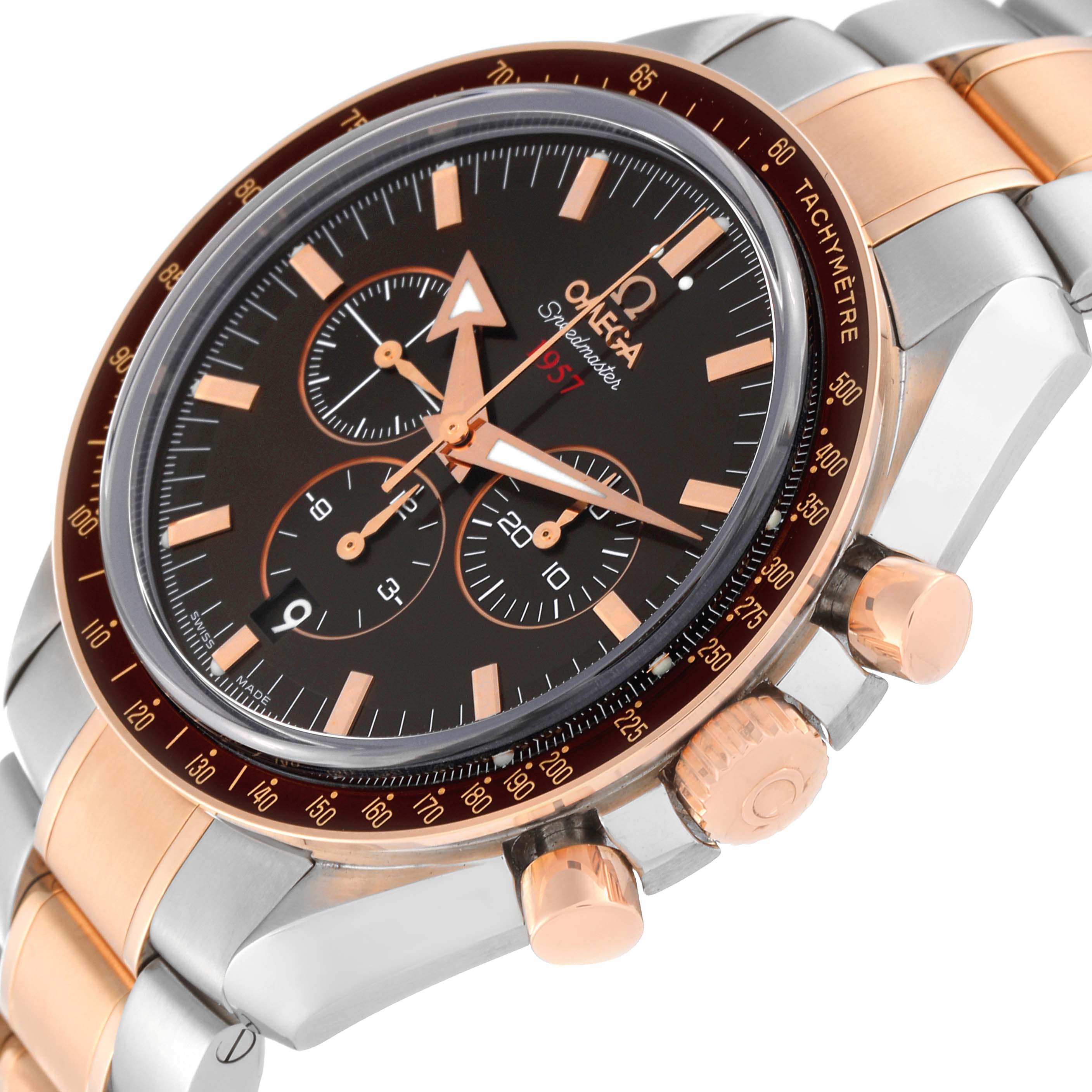 This Omega Speedmaster 321.90.42.50.13.001 Men's Steel and Gold (two tone) Brown Dial 321.90.42.50.13.001 Men's Steel and Gold (two tone) Brown Dial watch is shown from a close-up angle, highlighting the dial, bezel, pushers, and part of the bracelet.