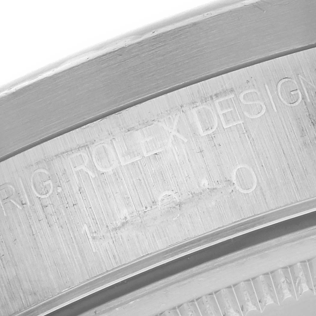 This image shows a close-up of the engravings on the side of the Rolex Air-King 14010 Men's Stainless Steel Silver Dial 14010 Men's Stainless Steel Silver Dial watch case, highlighting the branding and serial number.