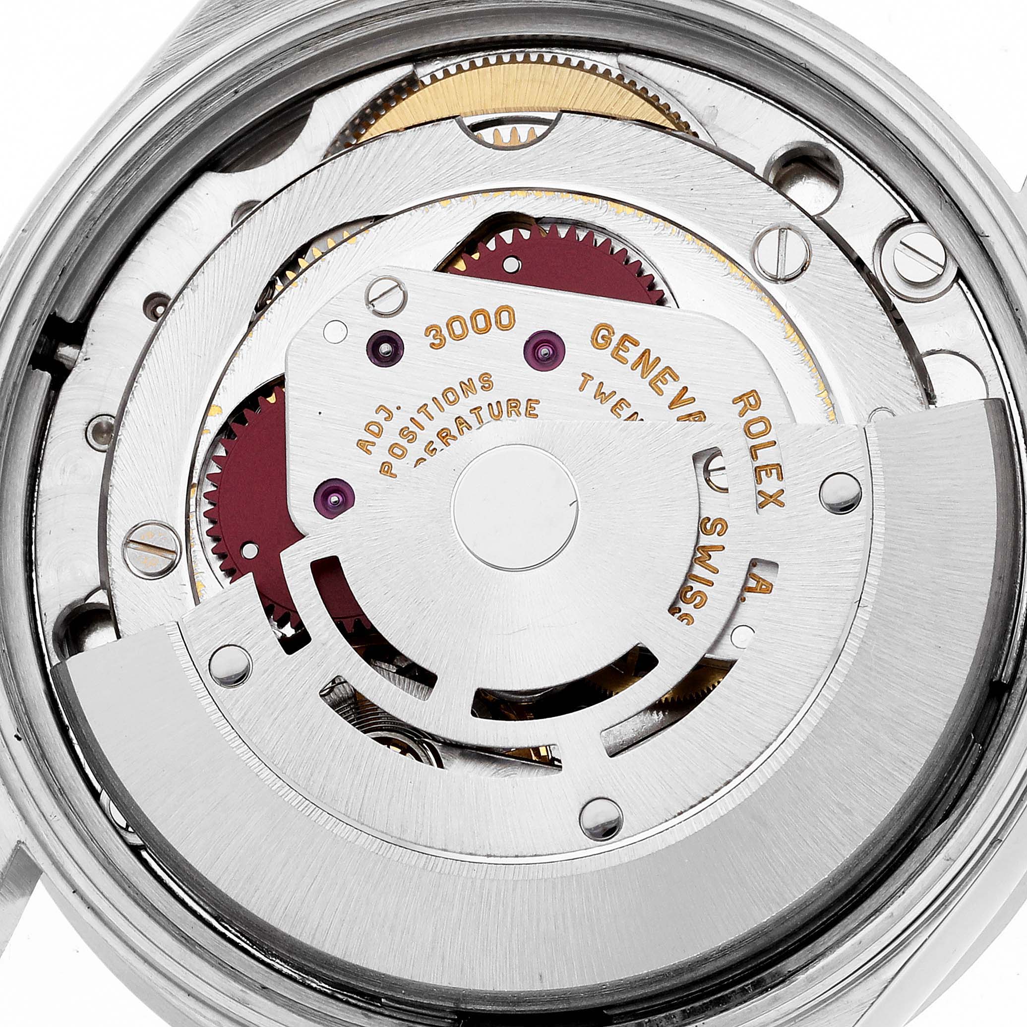 Shown is the movement of a Rolex Air-King 14010 Men's Stainless Steel Silver Dial 14010 Men's Stainless Steel Silver Dial watch, featuring intricate gears and engravings.