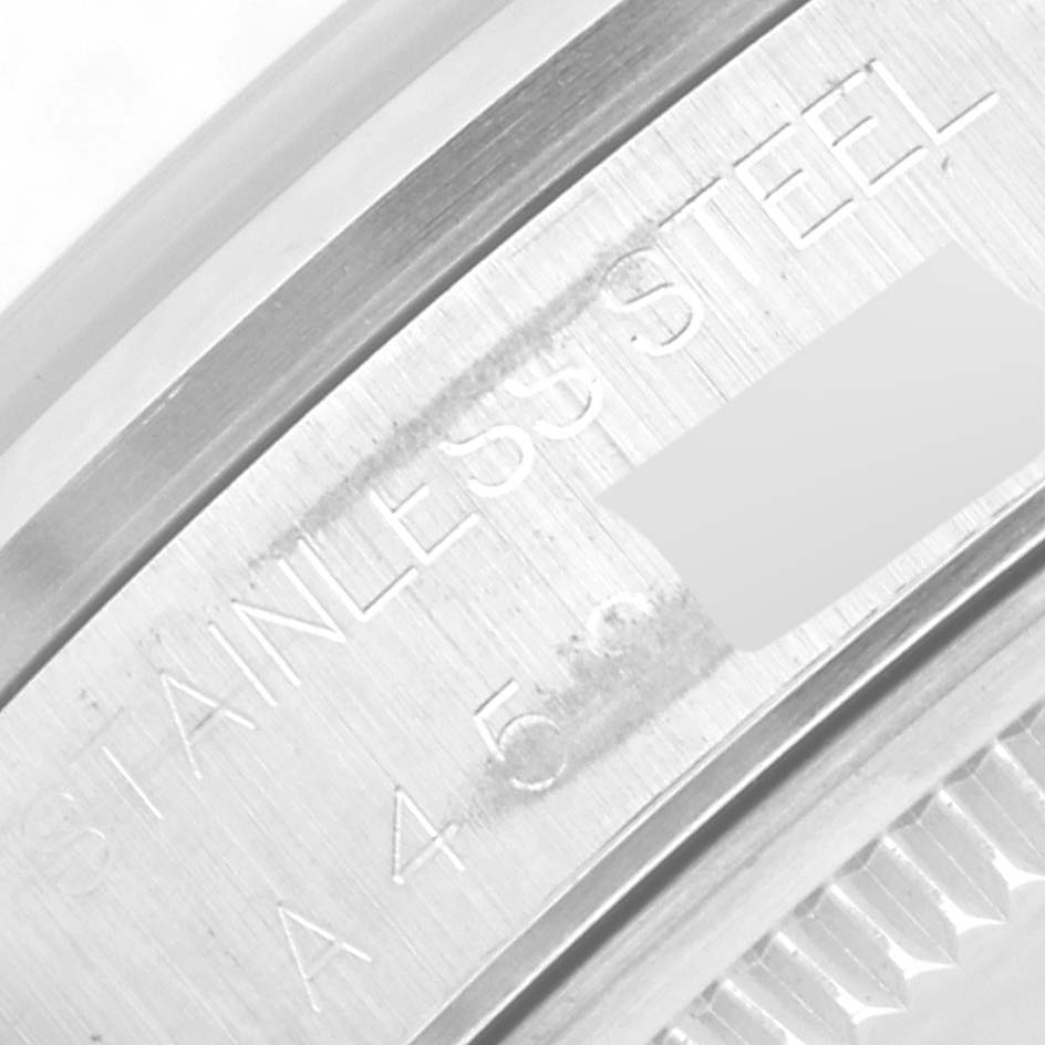 This close-up image shows part of the case back with "Stainless Steel" engraved on the Rolex Air-King 14000 Men's Stainless Steel Silver Dial 14000 Men's Stainless Steel Silver Dial model.