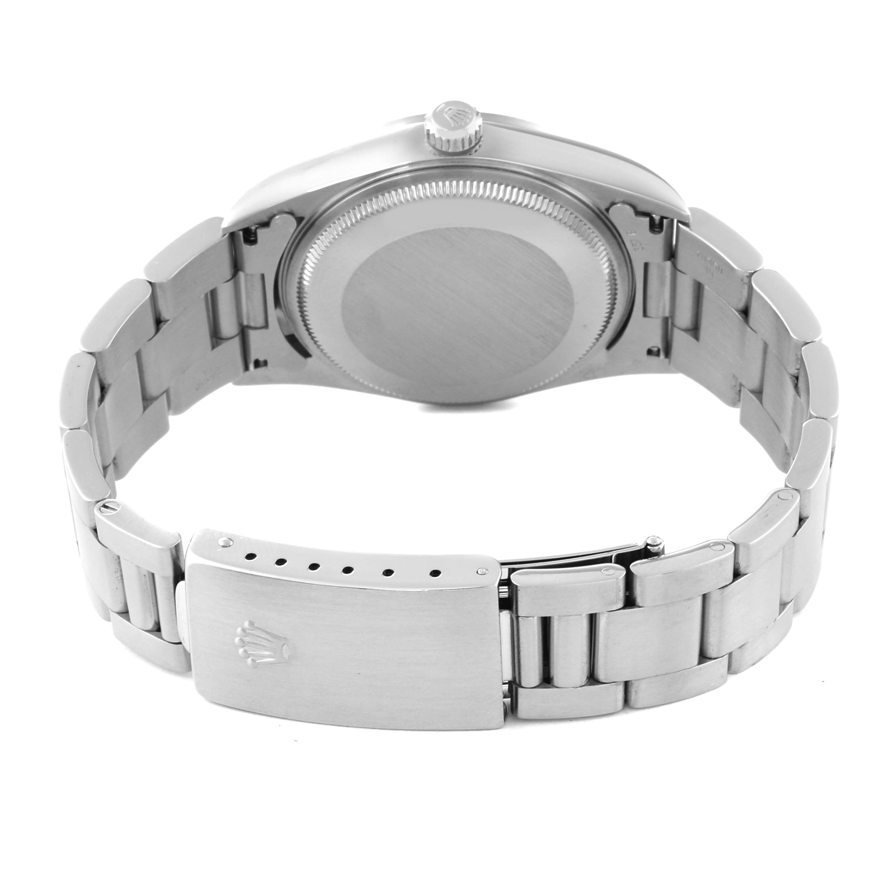 The image shows the back view of a Rolex Air-King 14000 Men's Stainless Steel Silver Dial 14000 Men's Stainless Steel Silver Dial watch, highlighting its case back, crown, and stainless steel bracelet with the clasp open.