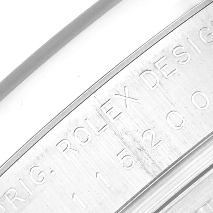 This image shows the engraved inner bezel of a Rolex Date 115200 Men's Stainless Steel Black Dial 115200 Men's Stainless Steel Black Dial model watch.