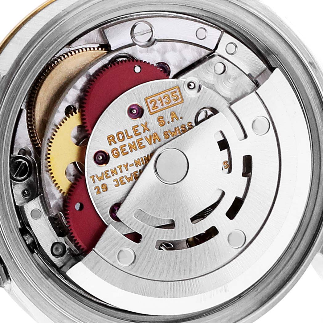 The image shows the inner mechanical movement of the Rolex Datejust 69173 Women's Steel and Gold (two tone) Blue Dial 69173 Women's Steel and Gold (two tone) Blue Dial watch, highlighting the rotor, gears, and inscriptions.