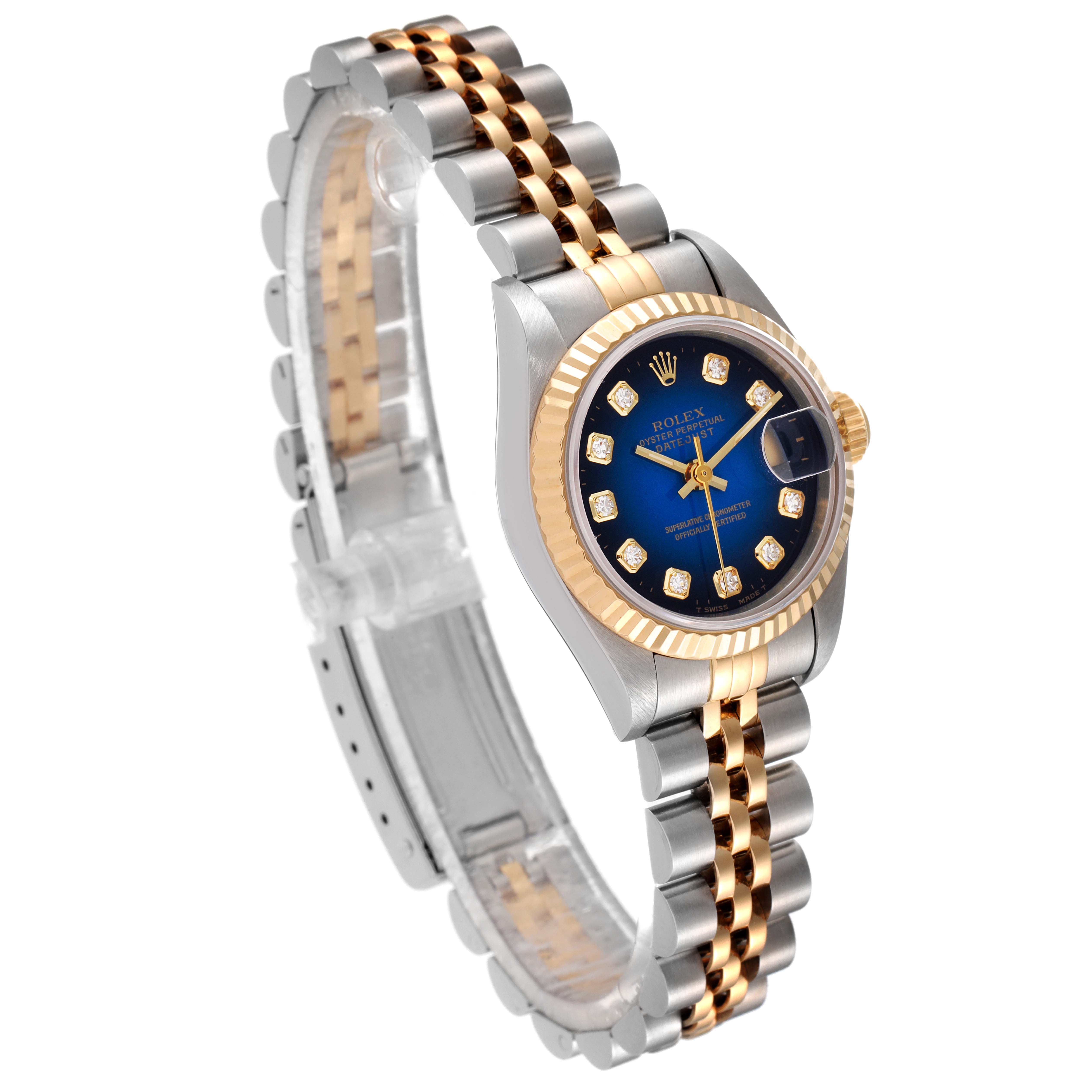 This image shows the Rolex Datejust 69173 Women's Steel and Gold (two tone) Blue Dial 69173 Women's Steel and Gold (two tone) Blue Dial watch from a three-quarter angle, highlighting its blue dial, jubilee bracelet, and gold-accented bezel.