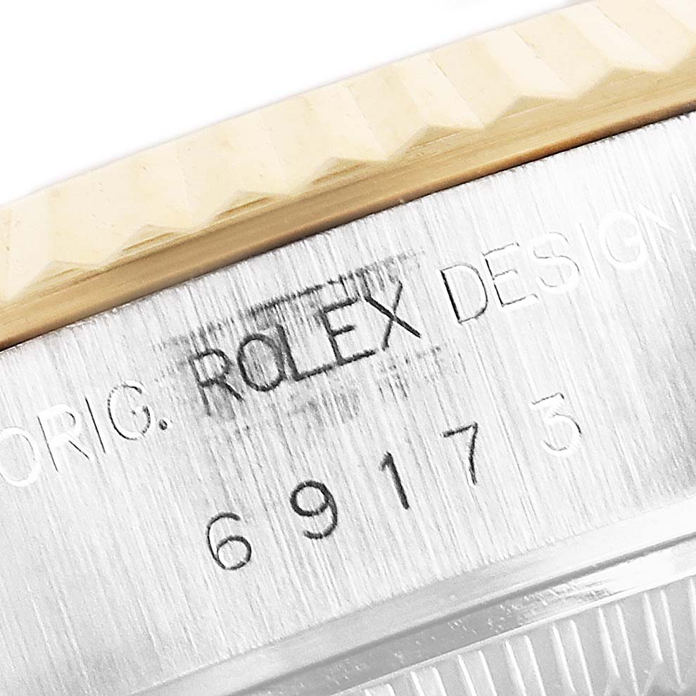 Close-up of the case side, revealing the Rolex Datejust 69173 Women's Steel and Gold (two tone) Blue Dial 69173 Women's Steel and Gold (two tone) Blue Dial model’s engraved details and serial number.