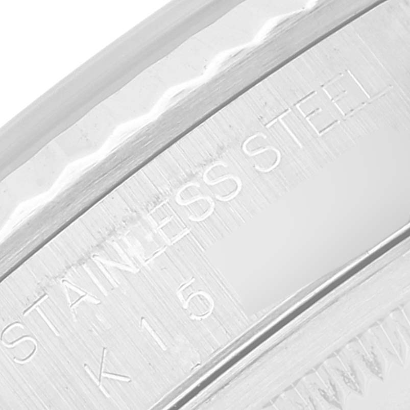 This close-up image shows the side of the case with engravings of a Rolex Datejust 16234 Men's Stainless Steel Blue Dial 16234 Men's Stainless Steel Blue Dial watch, highlighting its stainless steel part.