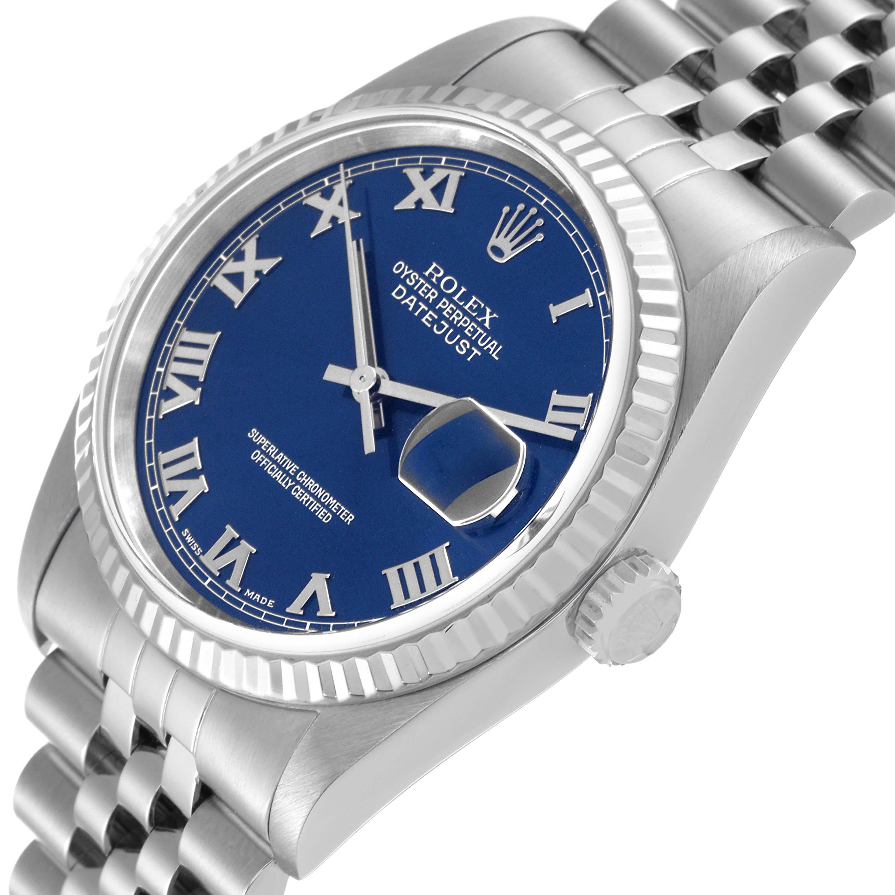 The image shows a Rolex Datejust 16234 Men's Stainless Steel Blue Dial 16234 Men's Stainless Steel Blue Dial watch at an angled side view, highlighting the blue dial, Roman numerals, fluted bezel, and Jubilee bracelet.