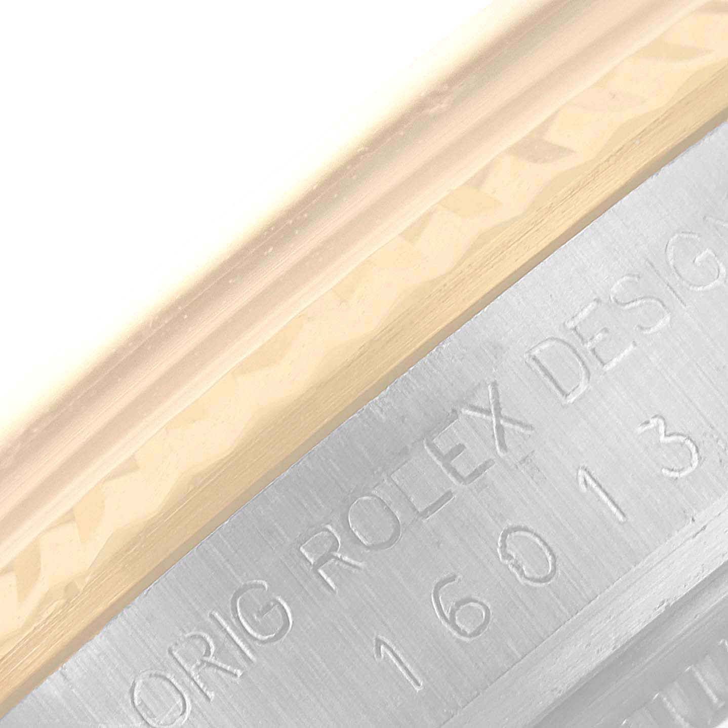 The image shows a close-up of the engraved bezel and case side of a Vintage Collection Rolex watch.