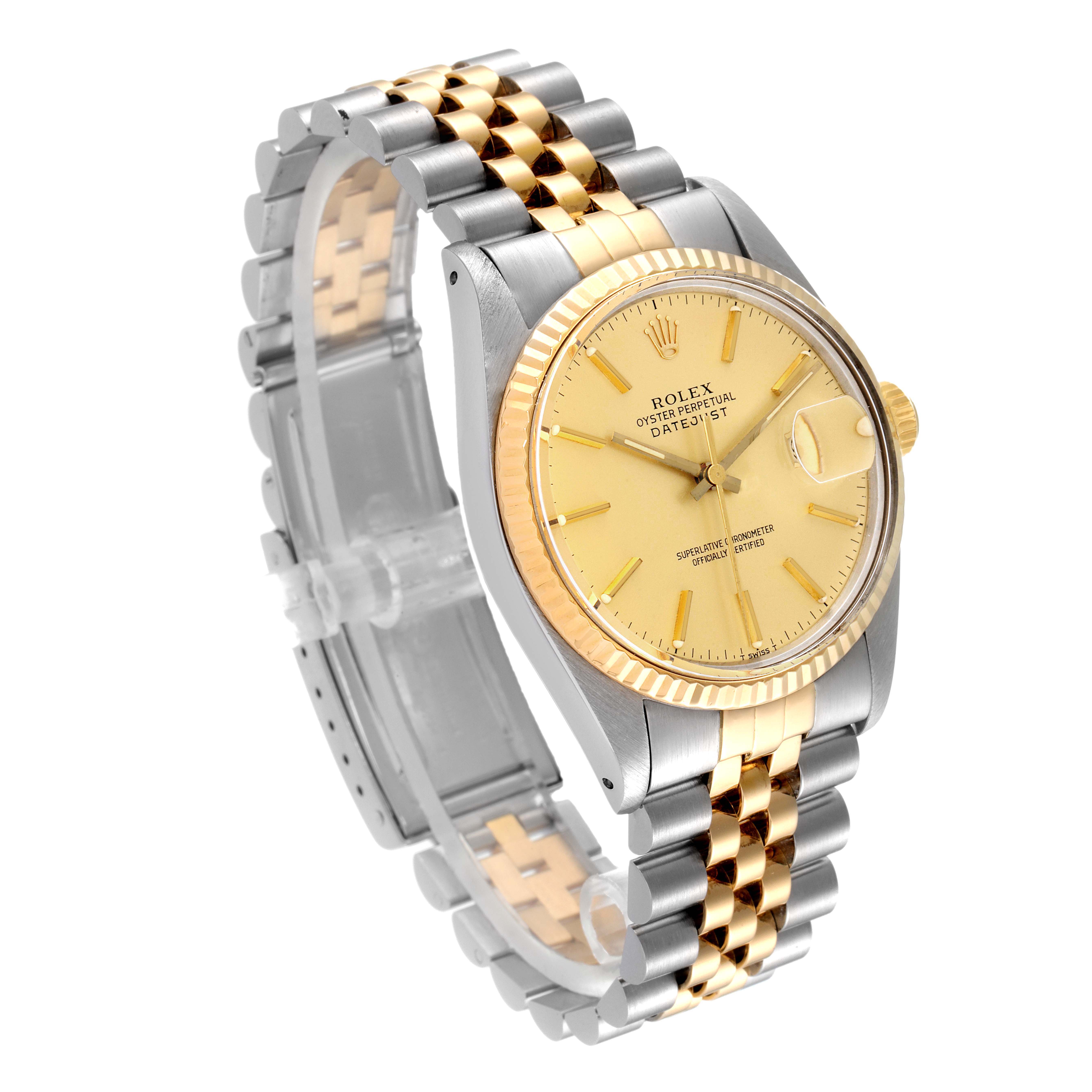 The image shows a Vintage Collection Rolex watch featuring a gold and silver bracelet, gold dial, and fluted bezel from a three-quarter angle.