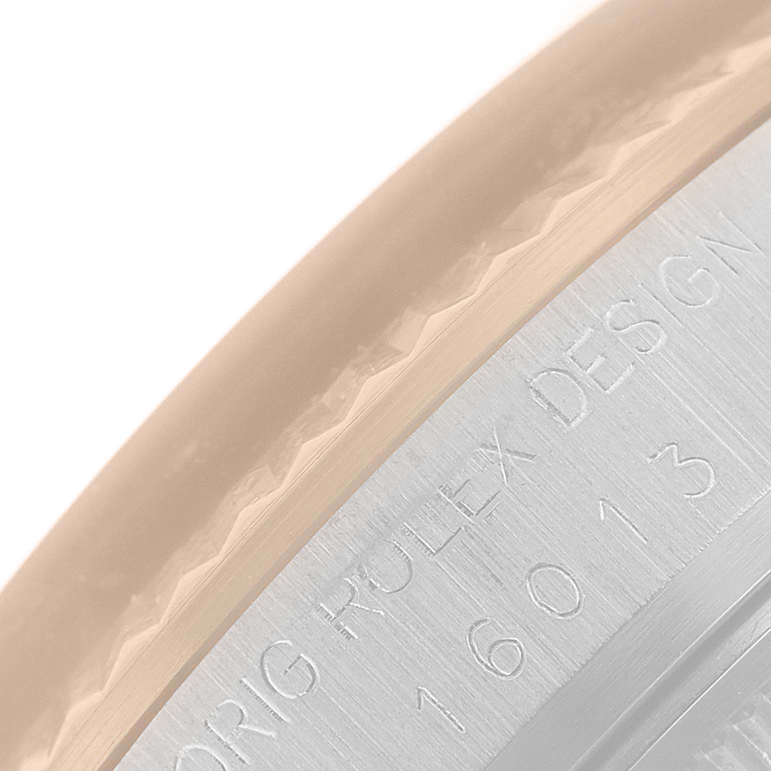 This close-up image shows a partial view of the bezel and the engraved serial number of the Rolex Vintage Collection 16013 Men's Steel and Gold (two tone) Champagne Dial 16013 Men's Steel and Gold (two tone) Champagne Dial model watch.