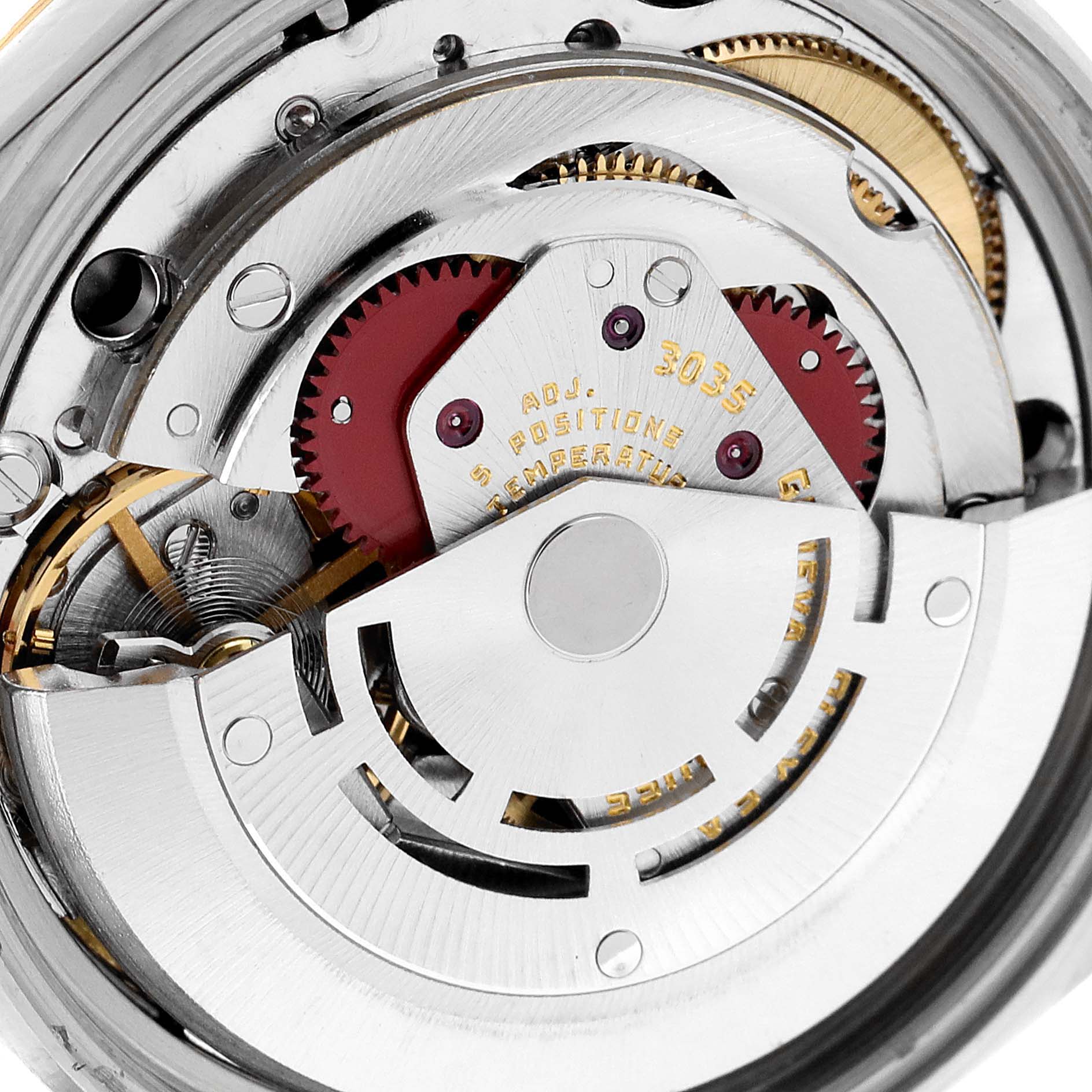 The image shows the intricate inner mechanism of a Vintage Collection model by Rolex, highlighting the gears and rotor.