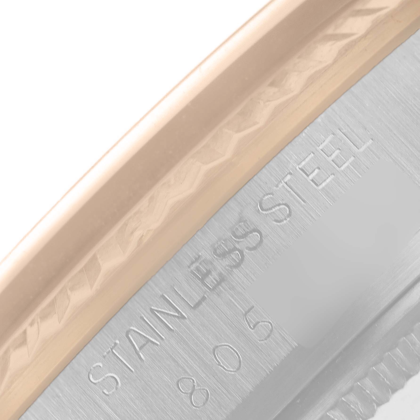 This image shows a close-up view of the stainless steel case back of a Vintage Collection watch by Rolex.