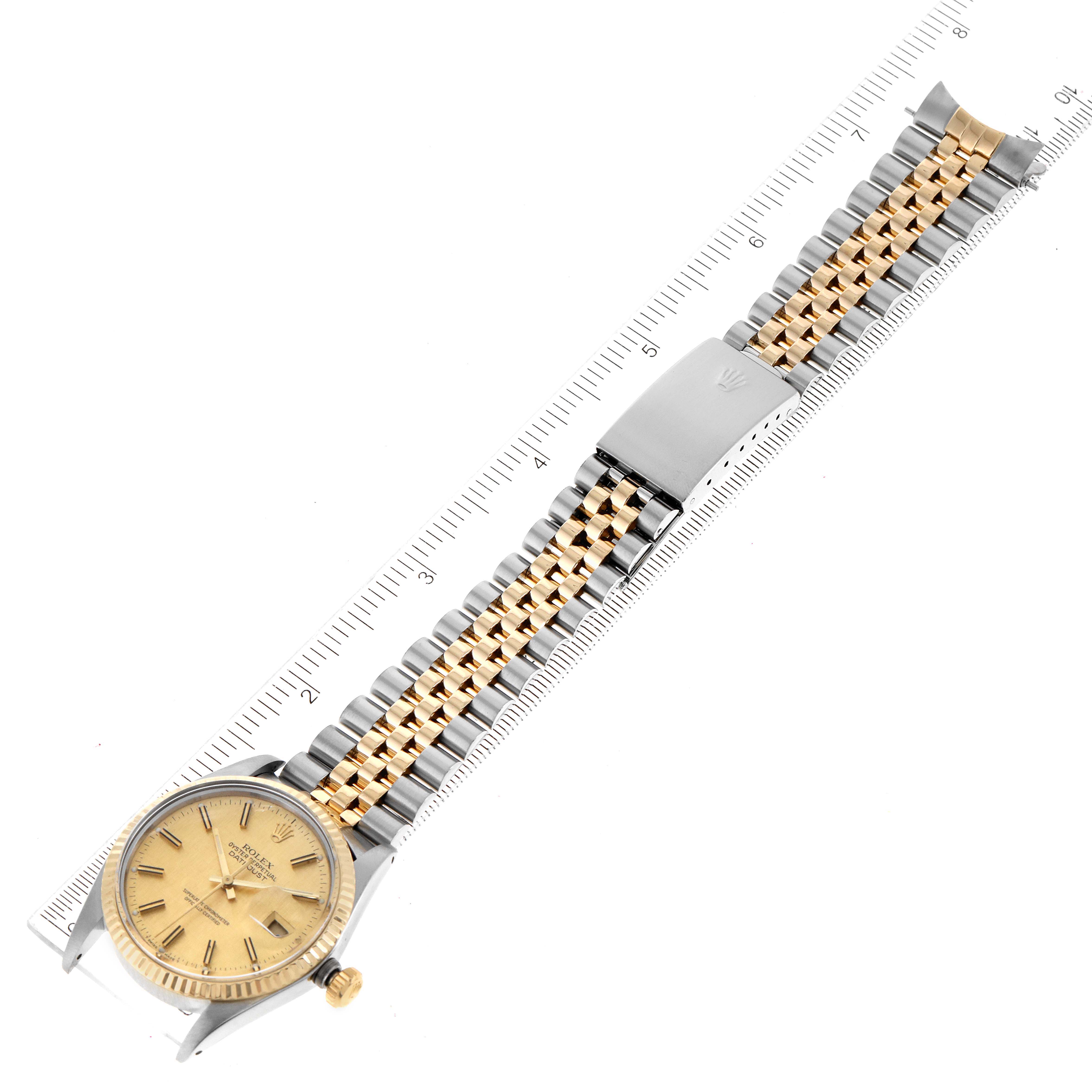 The Rolex Vintage Collection 16013 Men
s Steel and Gold (two tone) Champagne Dial 16013 Men
s Steel and Gold (two tone) Champagne Dial model watch is shown from an overhead angle, displaying its dial, bracelet, and clasp in full.