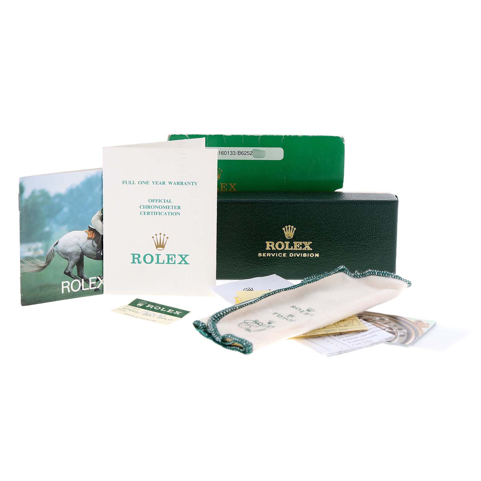 The image shows accessories for the Vintage Collection model by Rolex, including boxes, booklets, a warranty card, and a pouch.