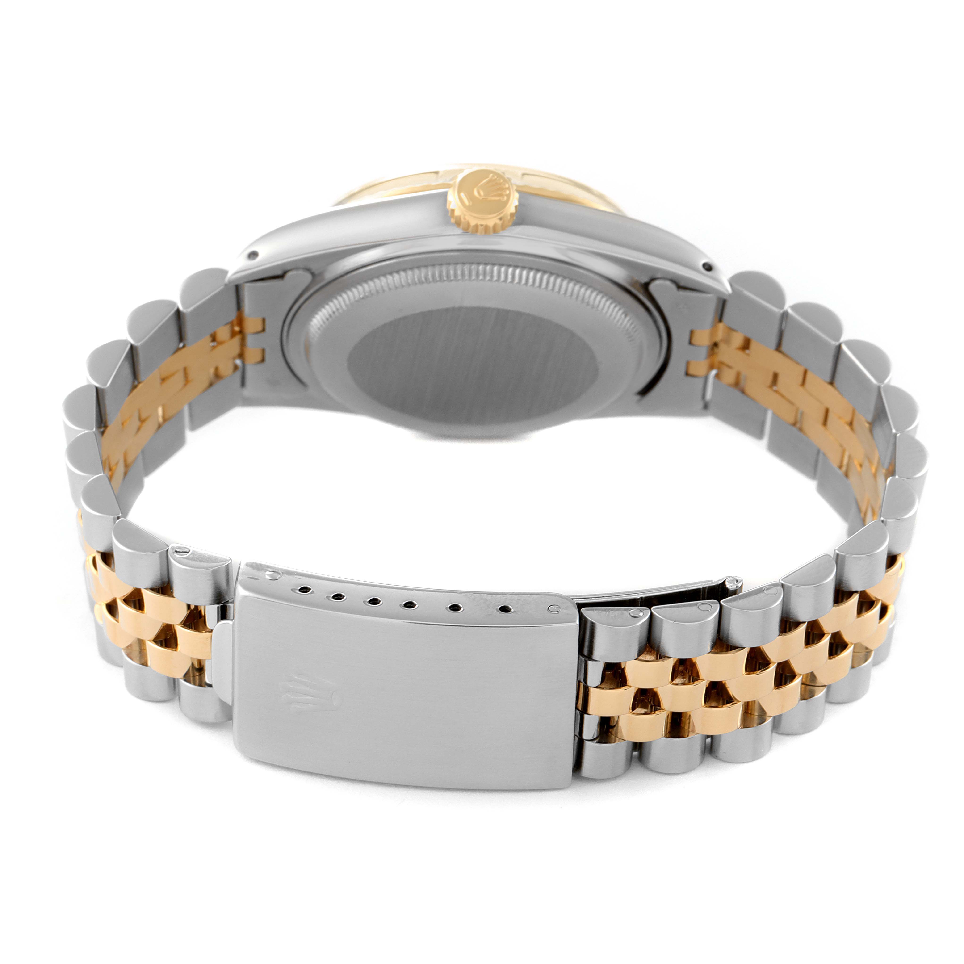 The image shows the back view of a Rolex Vintage Collection 16013 Men
s Steel and Gold (two tone) Champagne Dial 16013 Men
s Steel and Gold (two tone) Champagne Dial watch, highlighting its clasp, bracelet, case back, and crown.