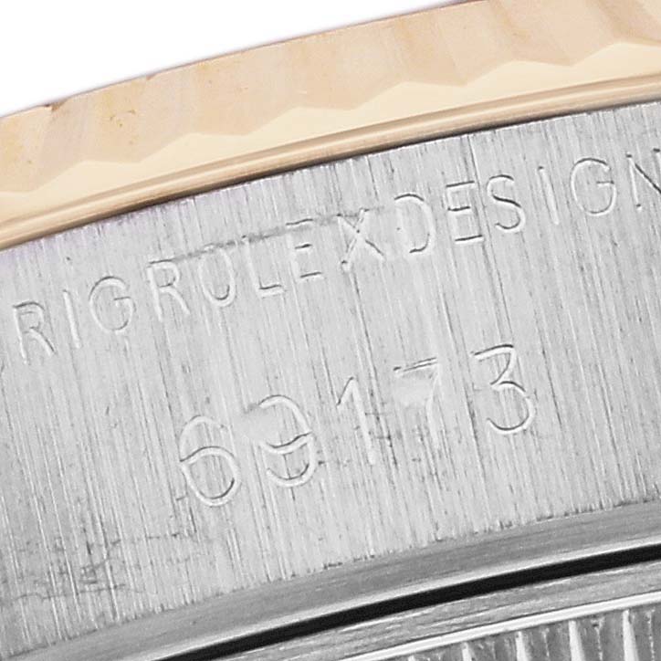 This close-up image shows the engraved model number and edge of the bezel of a Rolex Datejust 69173G Women's Steel and Gold (two tone) Black Dial 69173G Women's Steel and Gold (two tone) Black Dial watch.