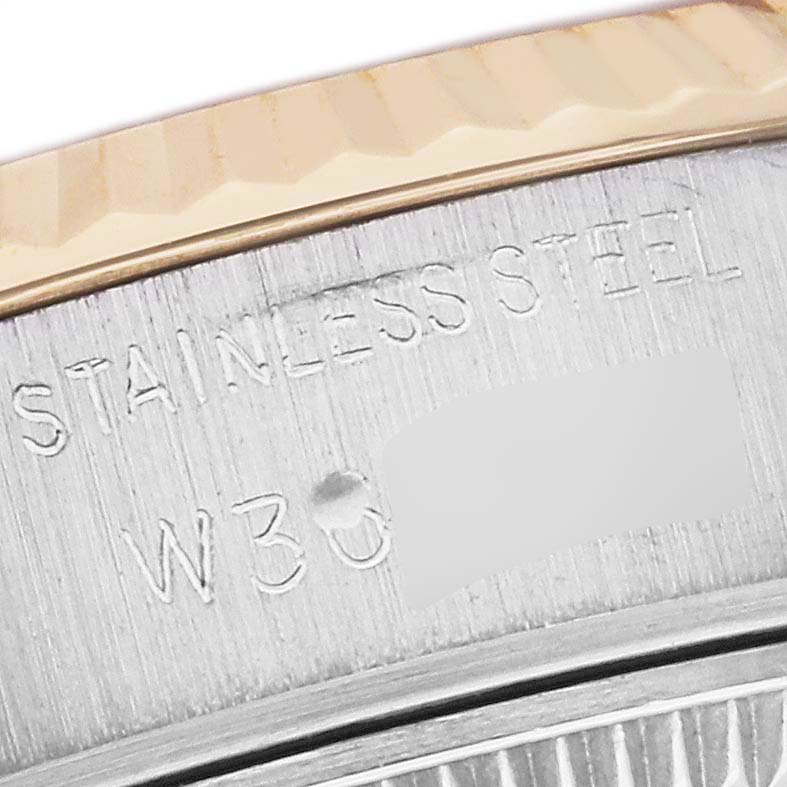 The image shows a close-up of the case back engraving on a Rolex Datejust 69173G Women's Steel and Gold (two tone) Black Dial 69173G Women's Steel and Gold (two tone) Black Dial watch, including "STAINLESS STEEL" text.